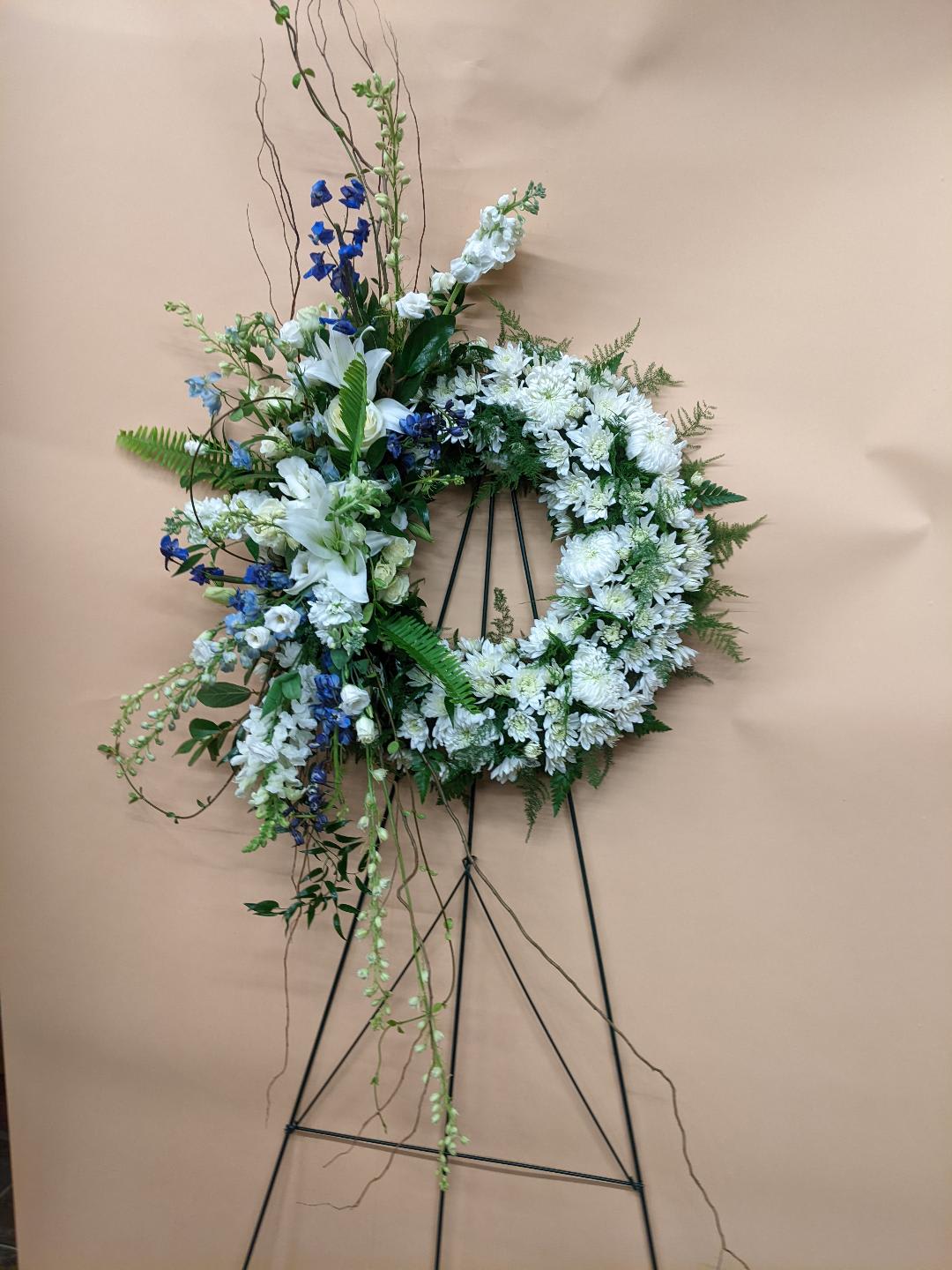 Ryan's Wreath - Ryan's Wreath is Made up of Seasonal Flowers Displayed on a Easel  WREATH CAN BE MADE UP OF THE COLORS OF YOUR LIKING