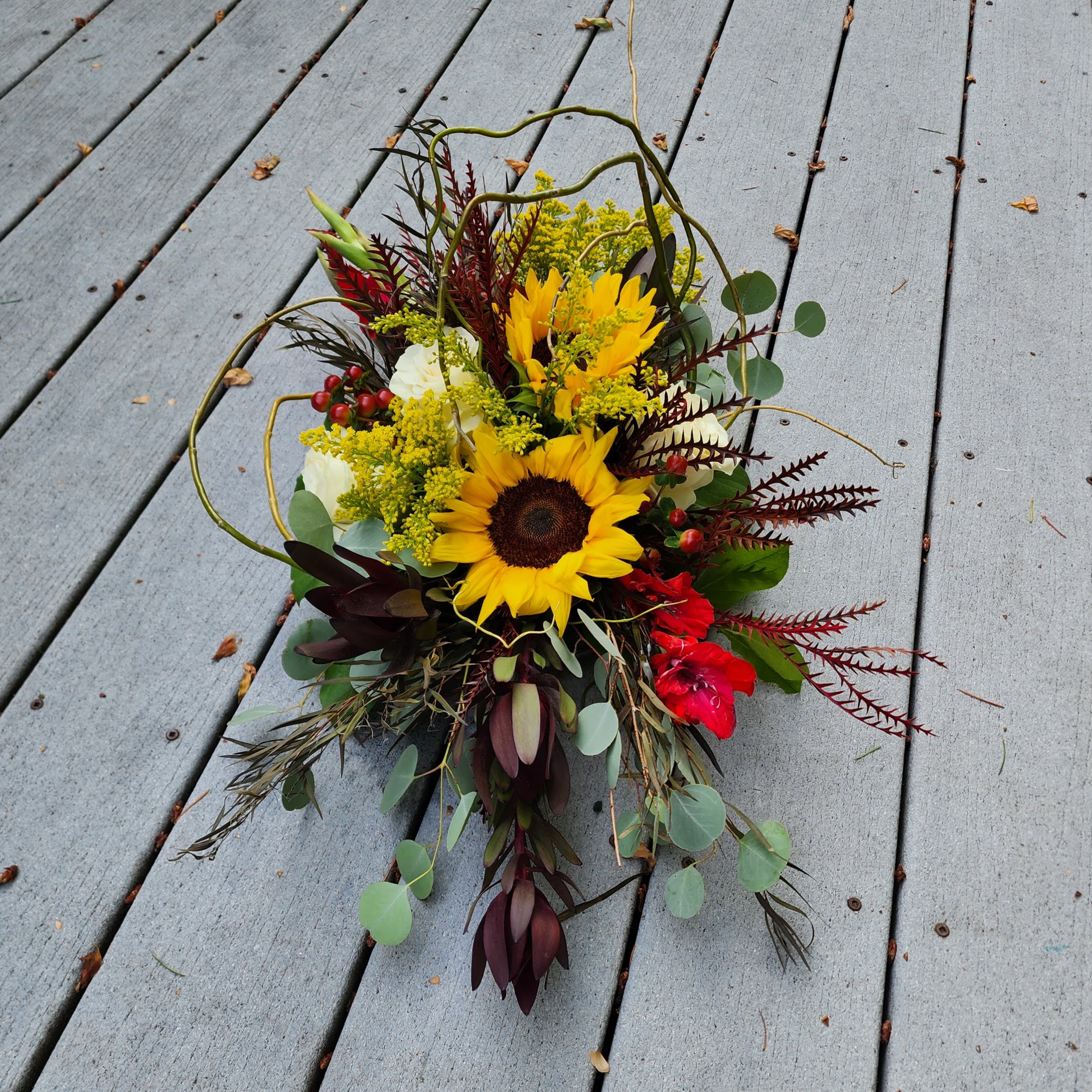 For the Love of Fall For the Love of Fall - ‘For the Love of Fall’ is one of our new inspirations for this season this year, it was requested by one of our clients. We like the design so much that we wanted it on our website. What makes this flower arrangement different is the unique design. Each time we design this style it’s a little different which makes a perfect autumn gift. The colors, flowers, and textures are a beautiful combination for any autumn occasion, maybe a birthday, get well soon, or just because. It will surely bring smiles to your friends and family. What sets Specialty Floral Design apart from other local shops is our design style. We are not the stereotypical old-school flower shop. Clients can call and request certain flowers, colors, or designs, and will be happy to cater to their wants and needs. With our flower shop centrally located in Olympia, WA, we have become the go-to flower shop for those local flower lovers that have a passion for flower style. We are a local flower shop that does same-day deliveries in Thurston County and the surrounding areas.