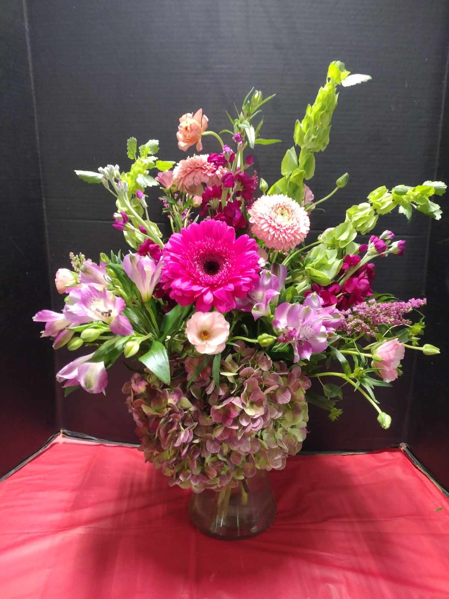 I FEEL LUCKY BOUQUET I FEEL LUCKY BOUQUET - This arrangement with full Victorian hydrangeas, accented with Bells Of Ireland, vivid Gerber daisies and heather set the mood for a wonderful Valentines evening