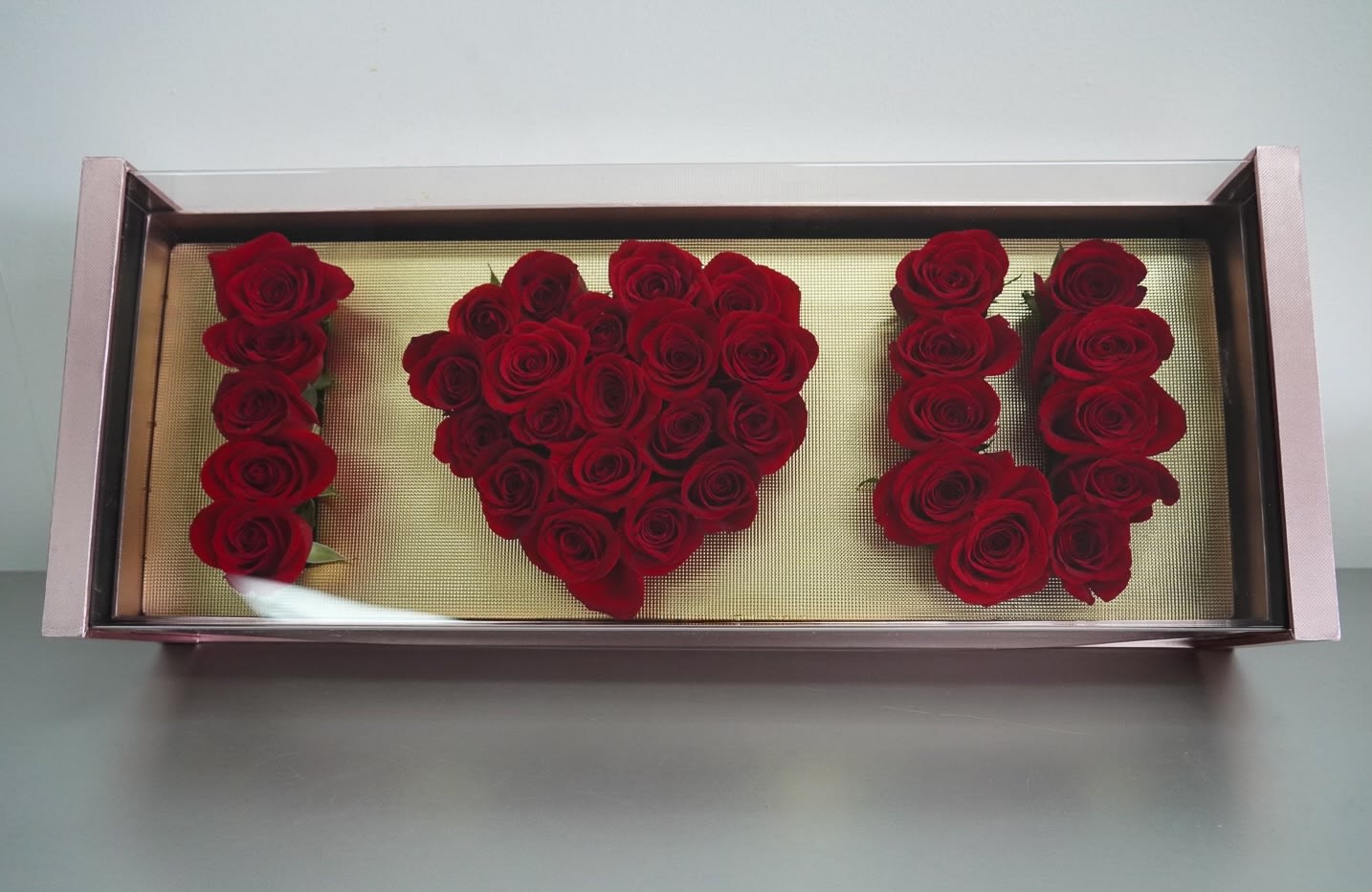 I Love You Flower Box By Atlanta's Finest Flowers  -  Fall in love with this box of two dozen of red roses  that says I LOVE YOU! Perfect for Anniversary, birthday or Valentine's Day.  * Material: Cardboard, plastic, acrylic  * Dimensions: 27x 13 x 7 inches  