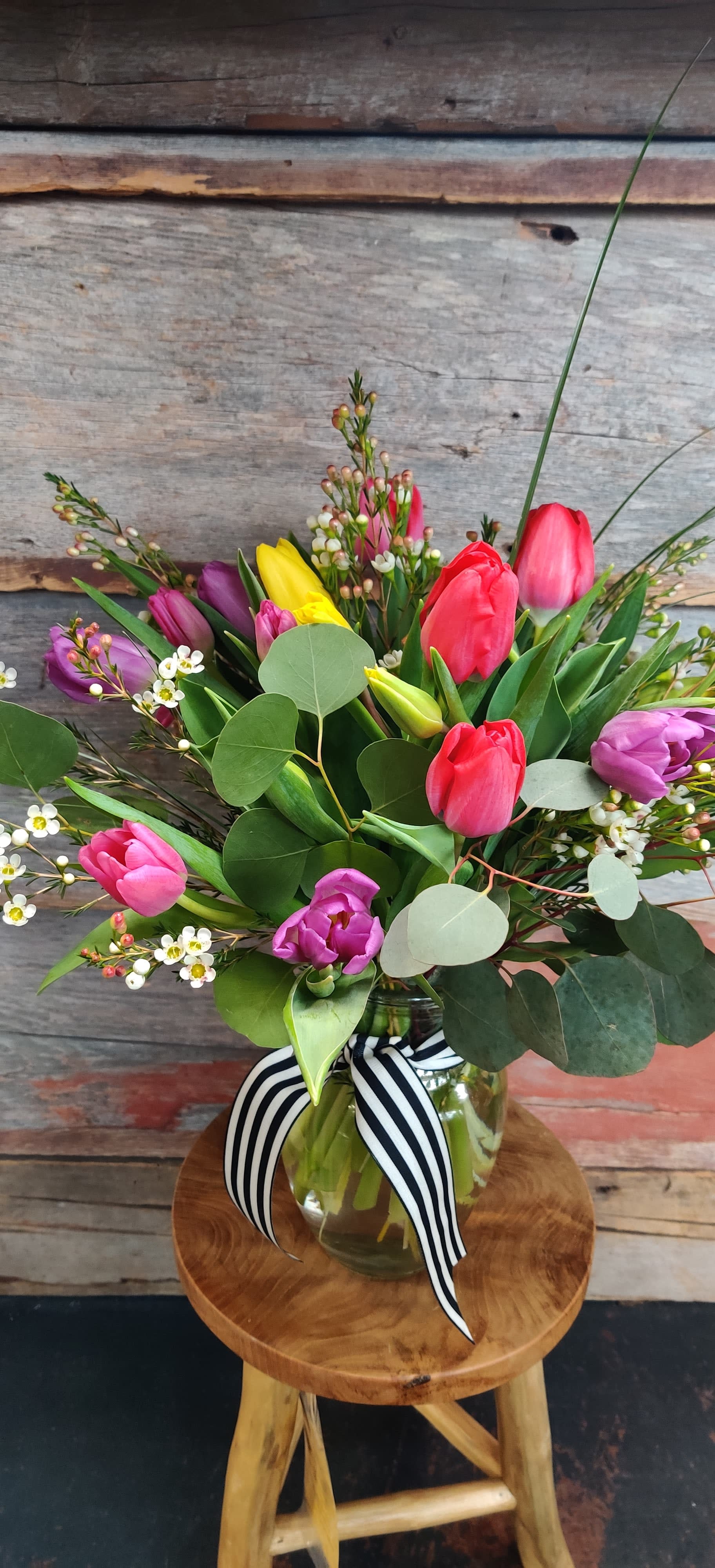 Tulips - Mixed colors of tulips all in a cute vase topped off with a  great accent ribbon