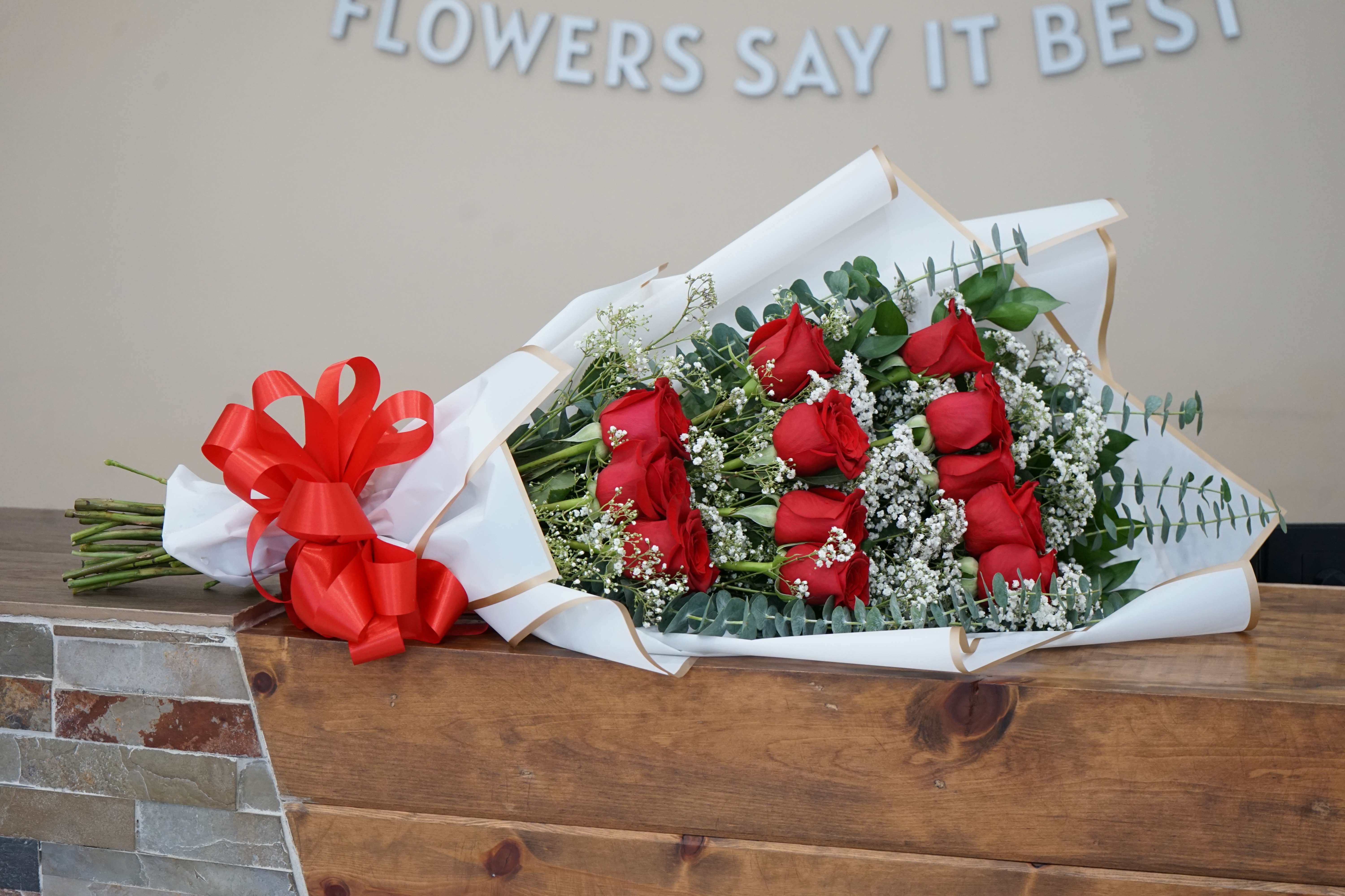 Dozen Red Roses Cascading Bouquet - Dozen red roses(or another color if you wish), wrapped in cascading fashion to give more volume to the bouquet. Elegance in simplicity. Item can be customized if you wish to give us a call at 832 916 3636. Thank you!