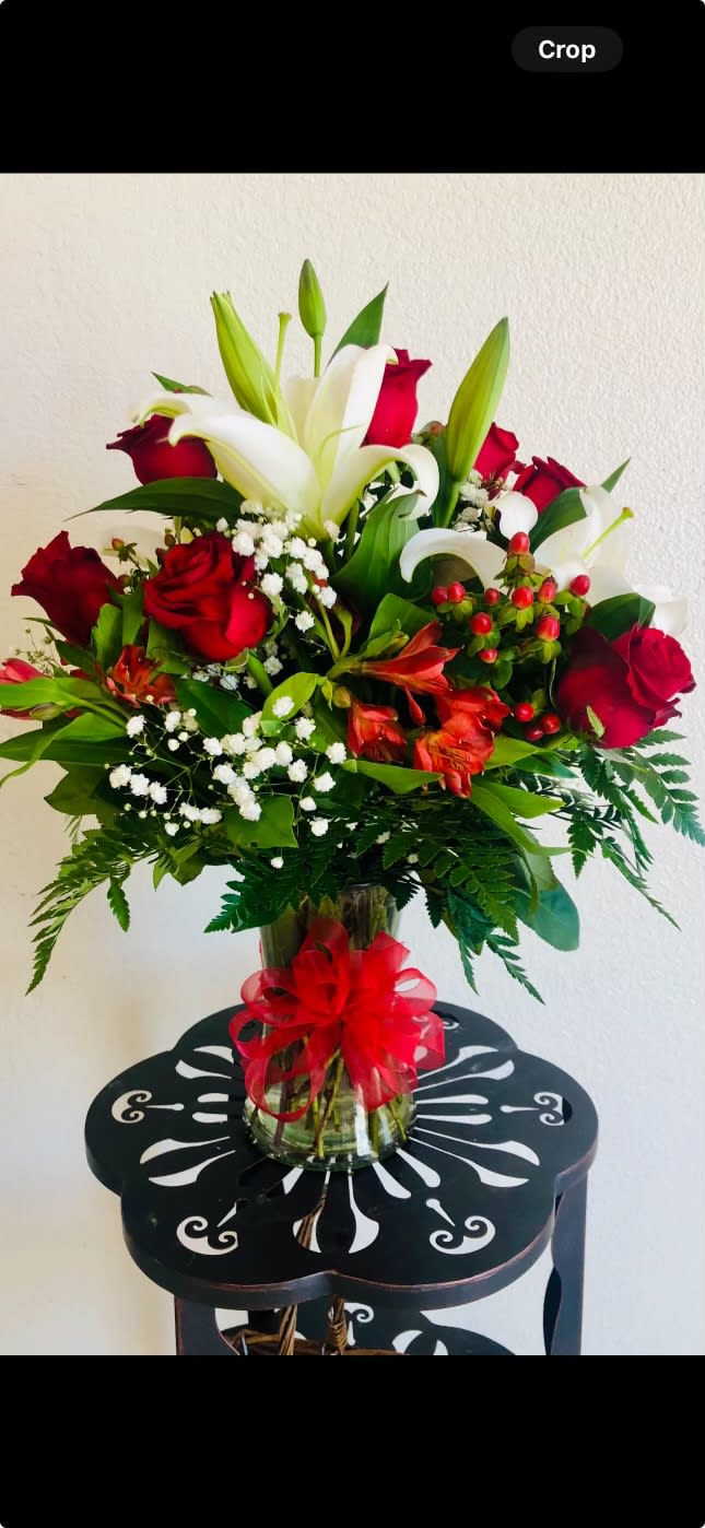 Red bliss Red bliss - An arrangement focused to accent a red vivid look with added white lilies to give it a bliss