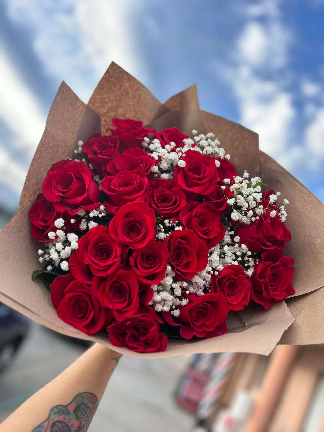 She's Perfect  - 25 Red roses in a wrapped bouquet.  with greens and babies breath. 