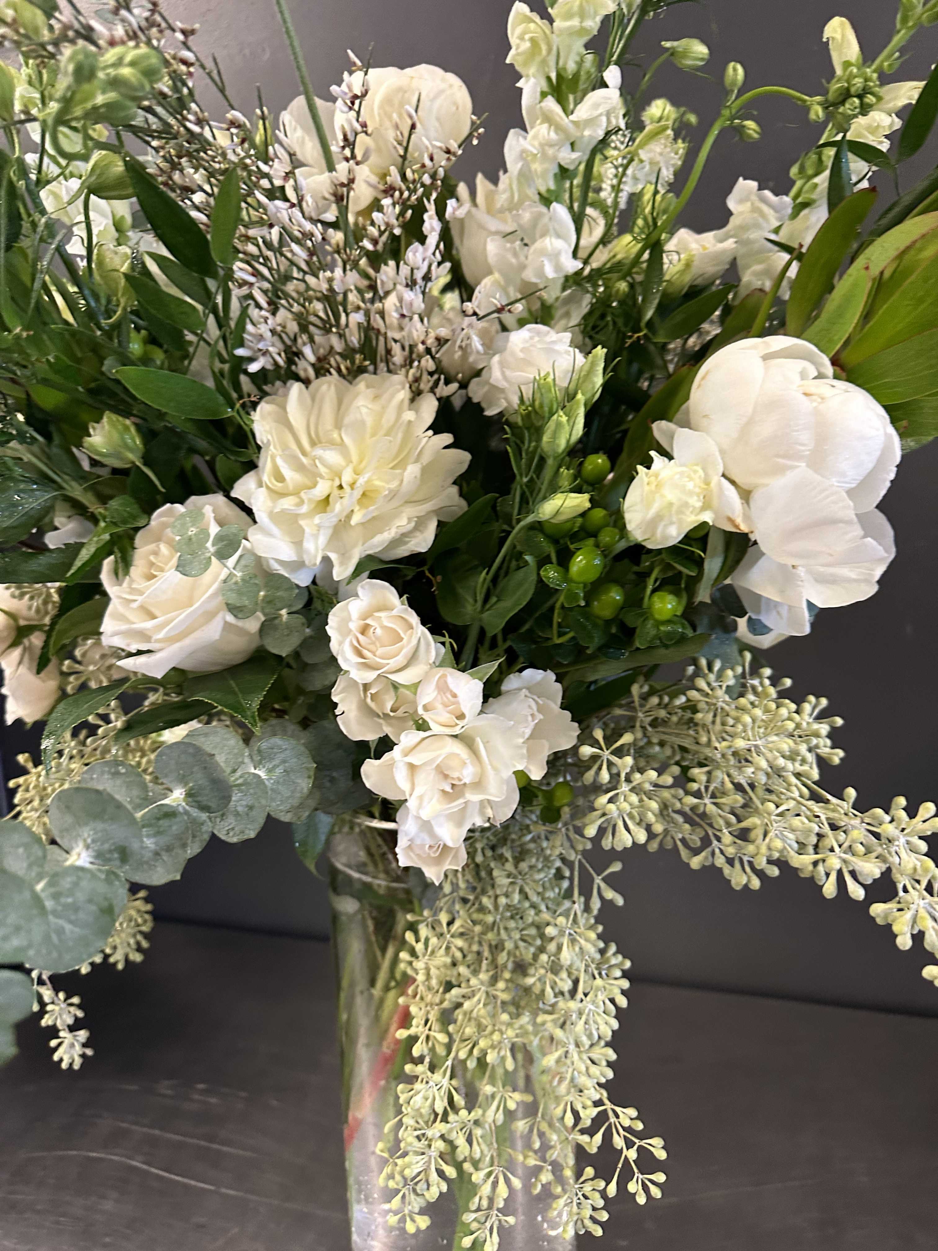 Looking For Love - Looking for something to impress your loved one....here it is!! A gorgeous assortment of premium white and green blooms in a tall vase. 