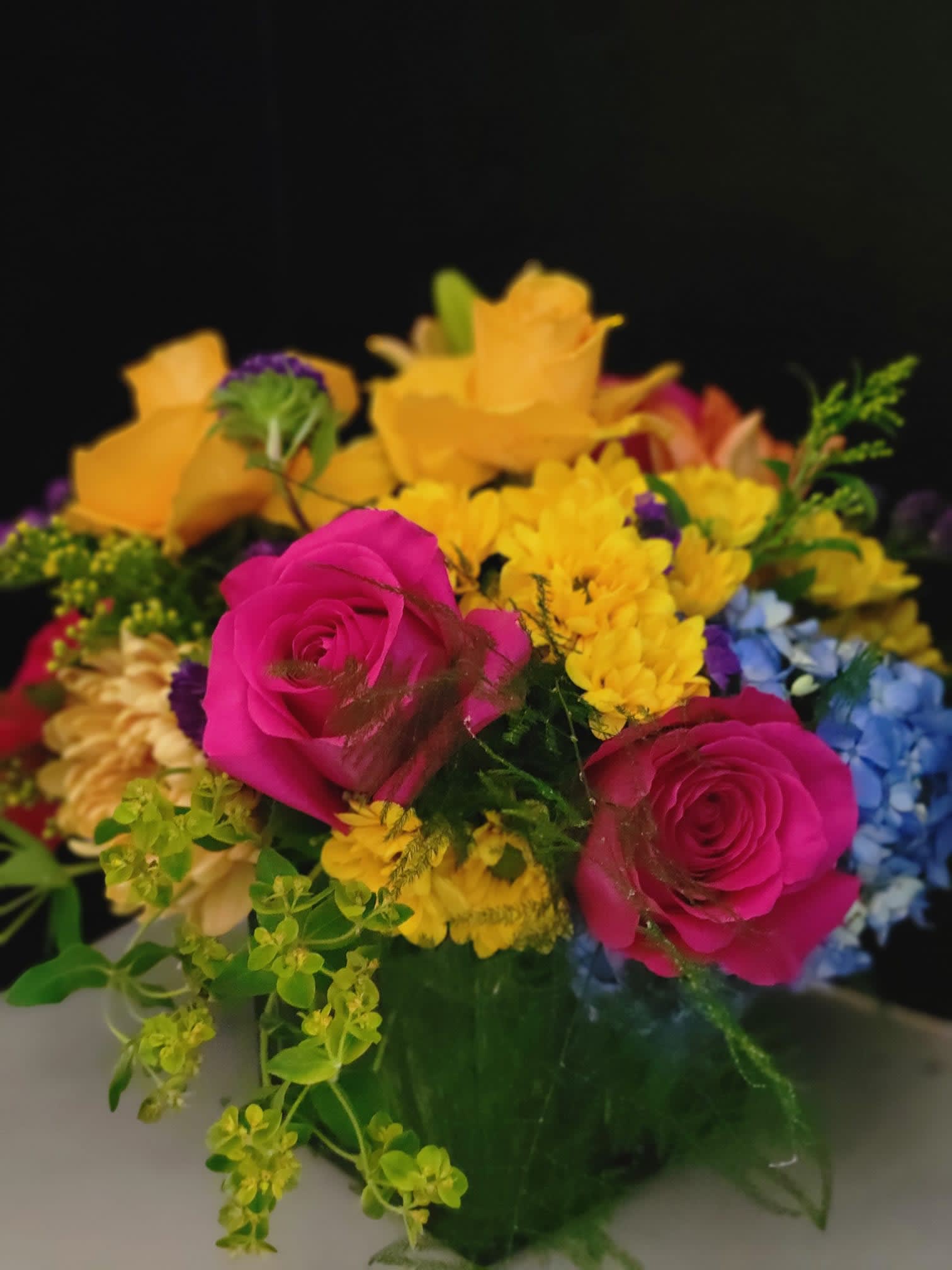 Smile, Sparkle, Shine - A vibrant color arrangement with hydrangeas, roses, stock, mums, and fillers