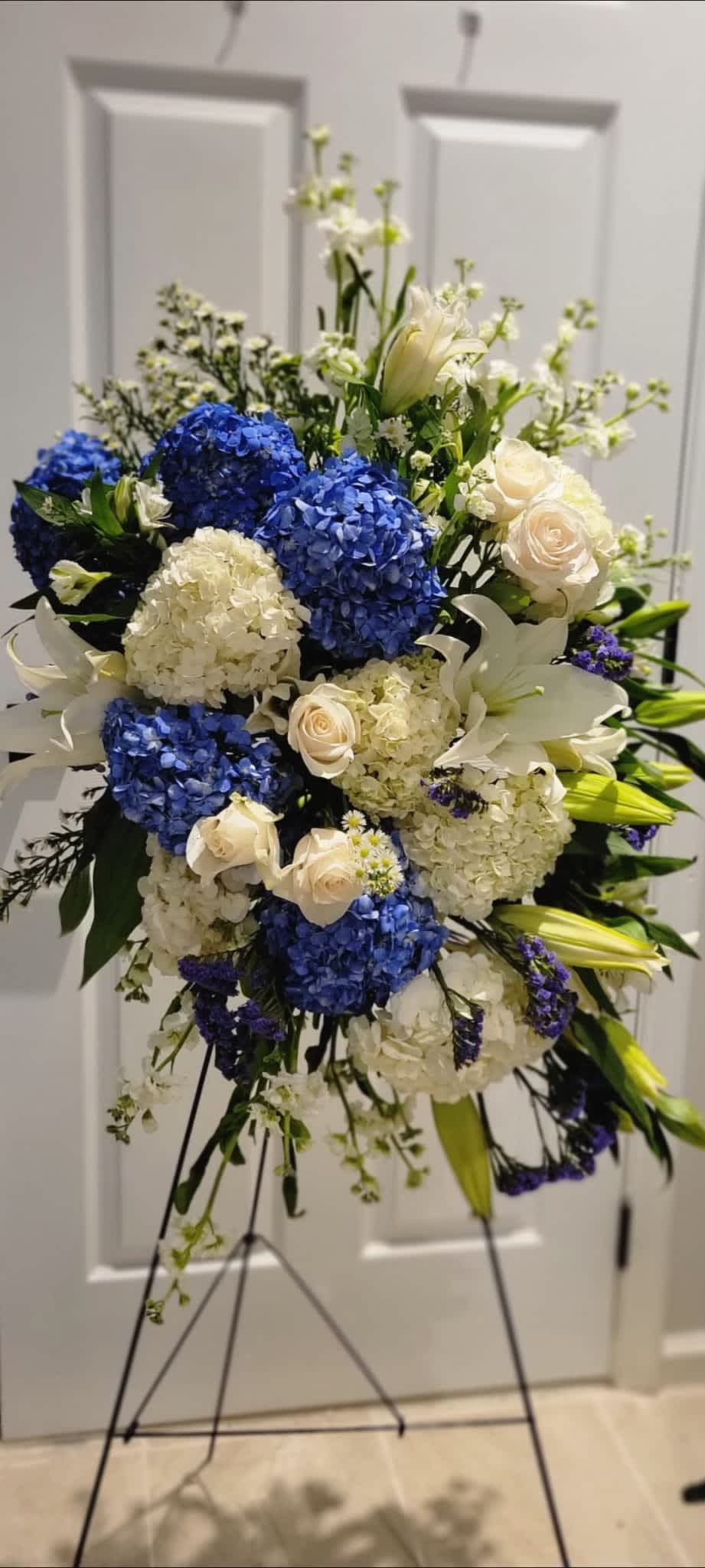 Devotion - Standing spray with Hydrangeas, stock, roses, aster, lilies, statice