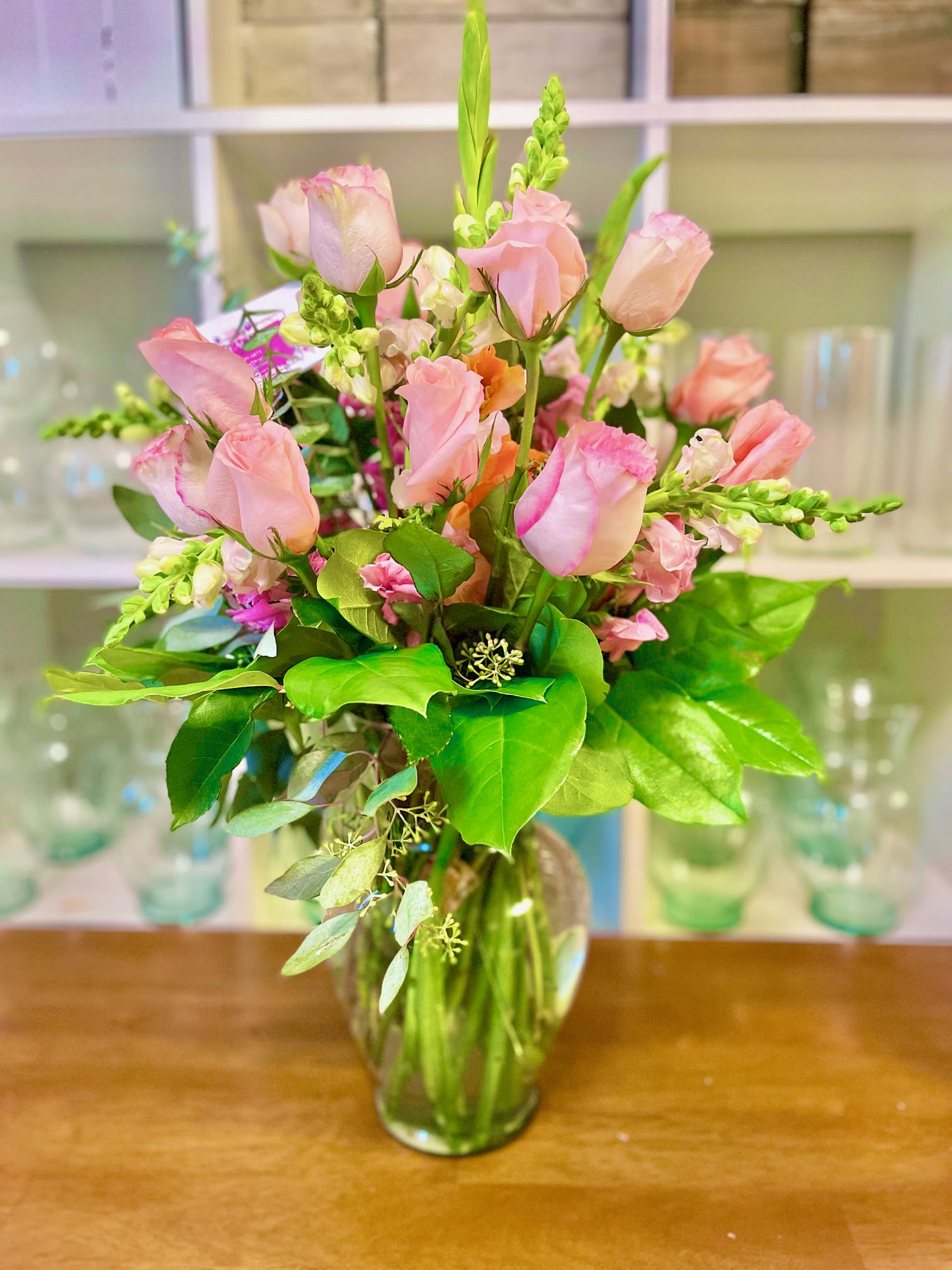 Just Peachy Just Peachy - Warm and welcoming arrangement with premium fresh blooms in a 9" clear glass vase.