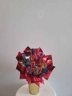 Candy Bouquet by Xochitl Flowers EP - Beautiful mixture of candies decorated in nice vase.