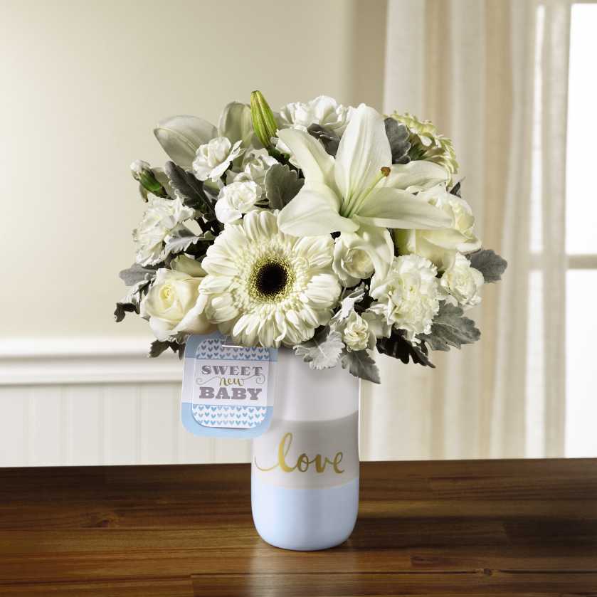 Sweet Baby Boy Bouquet Sweet Baby Boy Bouquet - Standard size (pictured) approx. 14"h X 10"w A beautiful arrangement celebrates the newest addition to your recipient's family.