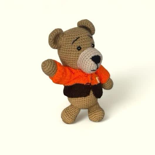 Handmade Knitted Teddy Bear #7 Handmade Knitted Teddy Bear #7 - Discover the charm of our Gift Shop's exclusive collection – One of a Kind handmade knit/crochet toys and dolls. Each piece is a quality keepsake and treasure, meticulously crafted from the finest natural wool and cotton. Every creation is a unique masterpiece, with our artisans pouring their hearts into every stitch. These are more than mere gifts; they are timeless prices that create cherished memories, destined to last a lifetime.