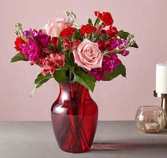 Cupid's Crush Bouquet - Take on the role of Cupid this Valentine's Day with an arrangement that strikes all the right heartstrings. With a sweet disposition of pink and red flowers in a bold, red vase, love will instantly be in the air the moment these blooms arrive. Standard Shown.