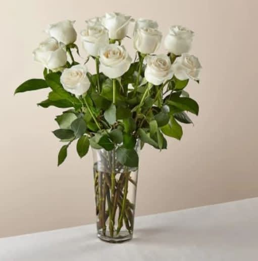 Long Stem White Rose Bouquet - White roses are elegant, luminous, and beautifully accent any room. With a gorgeous selection of crisp white roses among fresh greenery, this bouquet is perfect for birthdays, anniversaries, or as a way to say, Available in 12, 18, or 24 count.  The Original Bouquet is approximately 20&quot;H x 15&quot;W.