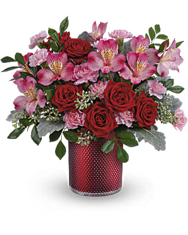 Teleflora's Scarlet Diamond Bouquet Teleflora's Scarlet Diamond Bouquet - Embossed with an elegant diamond pattern and shimmering with a pearlescent finish, this glam glass vase makes V-Day extra special when filled with a beautiful red and pink bouquet. This arrangement includes red spray roses, pink alstroemeria, miniature light pink carnations, dusty miller, seeded eucalyptus and huckleberry. This red and pink bouquet is delivered in Teleflora's Scarlet Diamond Cylinder.