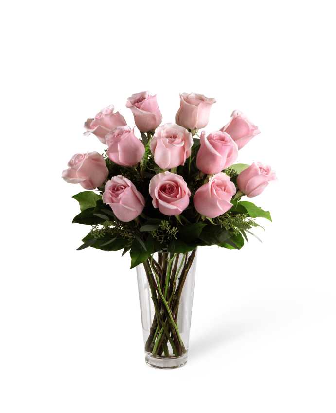 The FTD Pink Rose Bouquet - The FTD Pink Rose Bouquet is a graceful expression of blushing beauty to convey your deepest sympathies for their loss. Our finest pastel pink roses are perfectly accented with seeded eucalyptus and arranged in a clear glass vase to create a soft sentiment of cheerful wishes that will bring comfort and warmth during this trying time.