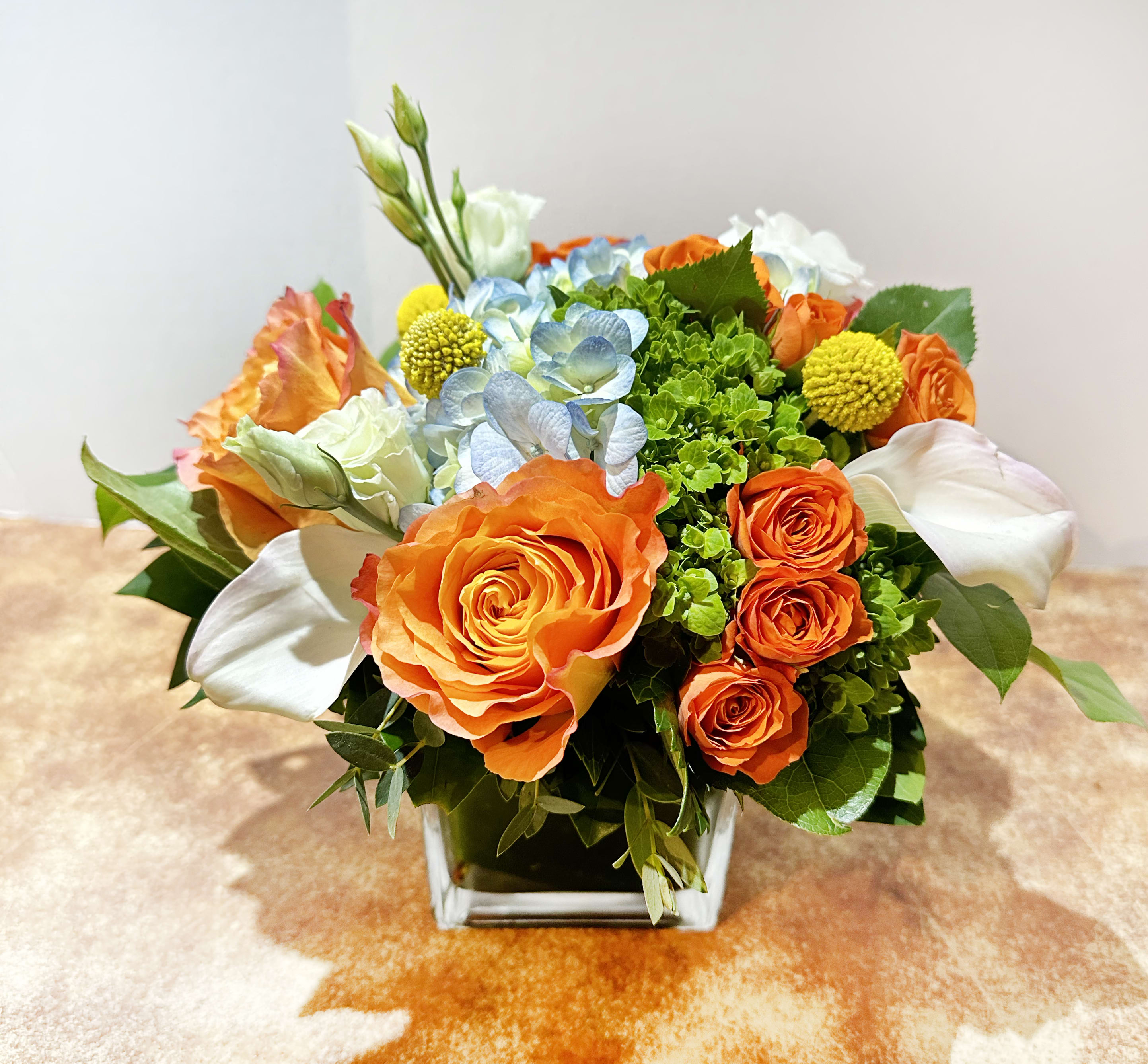 Cheer Up Cube - This arrangement is presented in a 4&quot; cube glass vase, in a bright color palette. It's a perfect gift to cheer up someone. 