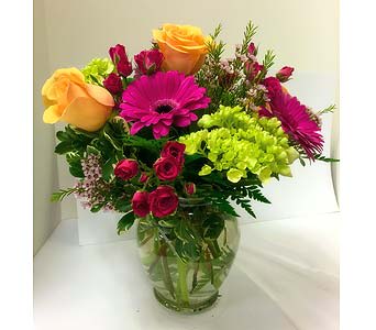 The Ginger Jar - Bright and colorful arrangement of roses, hydrangea and other mixed flowers