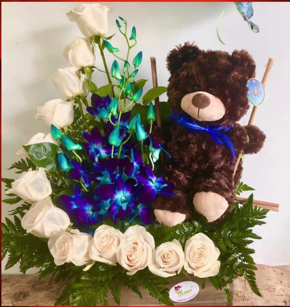 WELCOM BEAR - 12 WHITE ROSES AND BLUE DENDROBIUM ORCHID, WITH A TEDDY BEAR IN A BAMBOO SEAT 15 ROSES DELUXE AND 18 ROSES ITS THE PREMIUM ONE