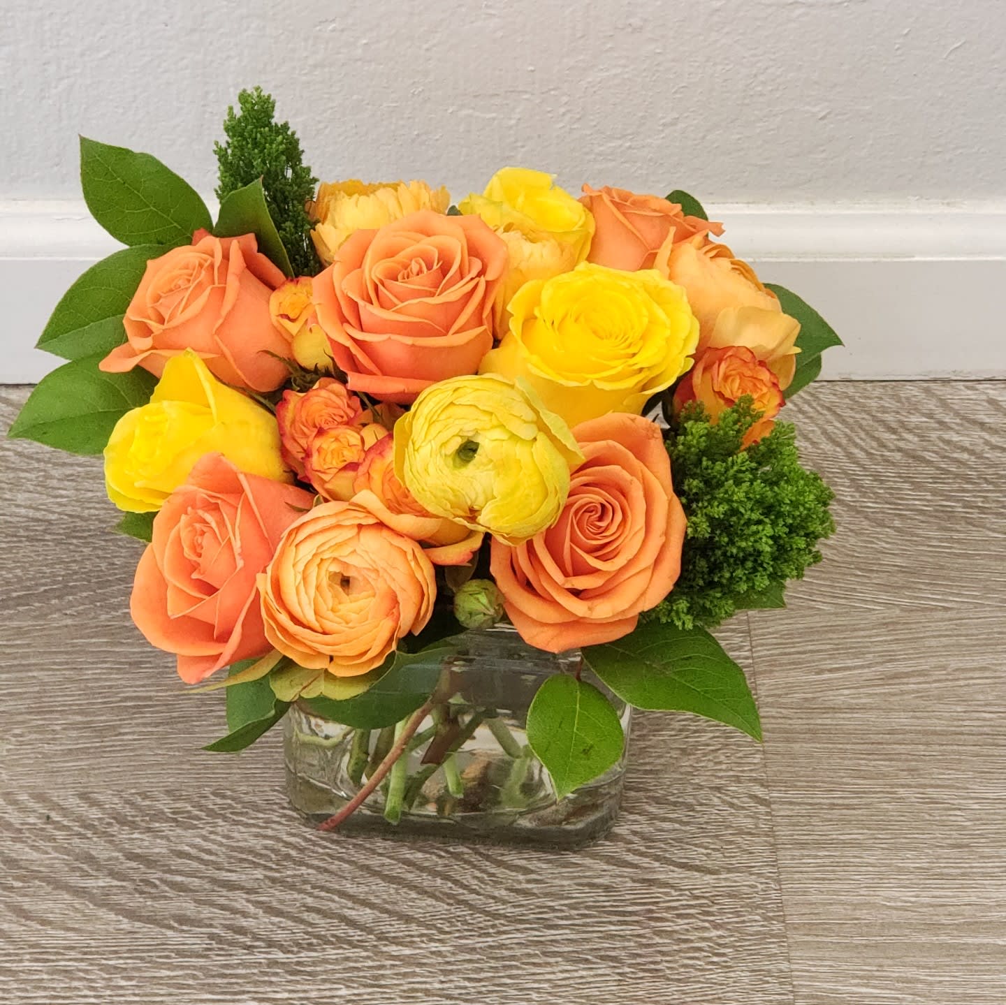 Sunny Delight Sunny Delight - Gift this vibrant bouquet with roses and ranunculi to your friends and loved ones!