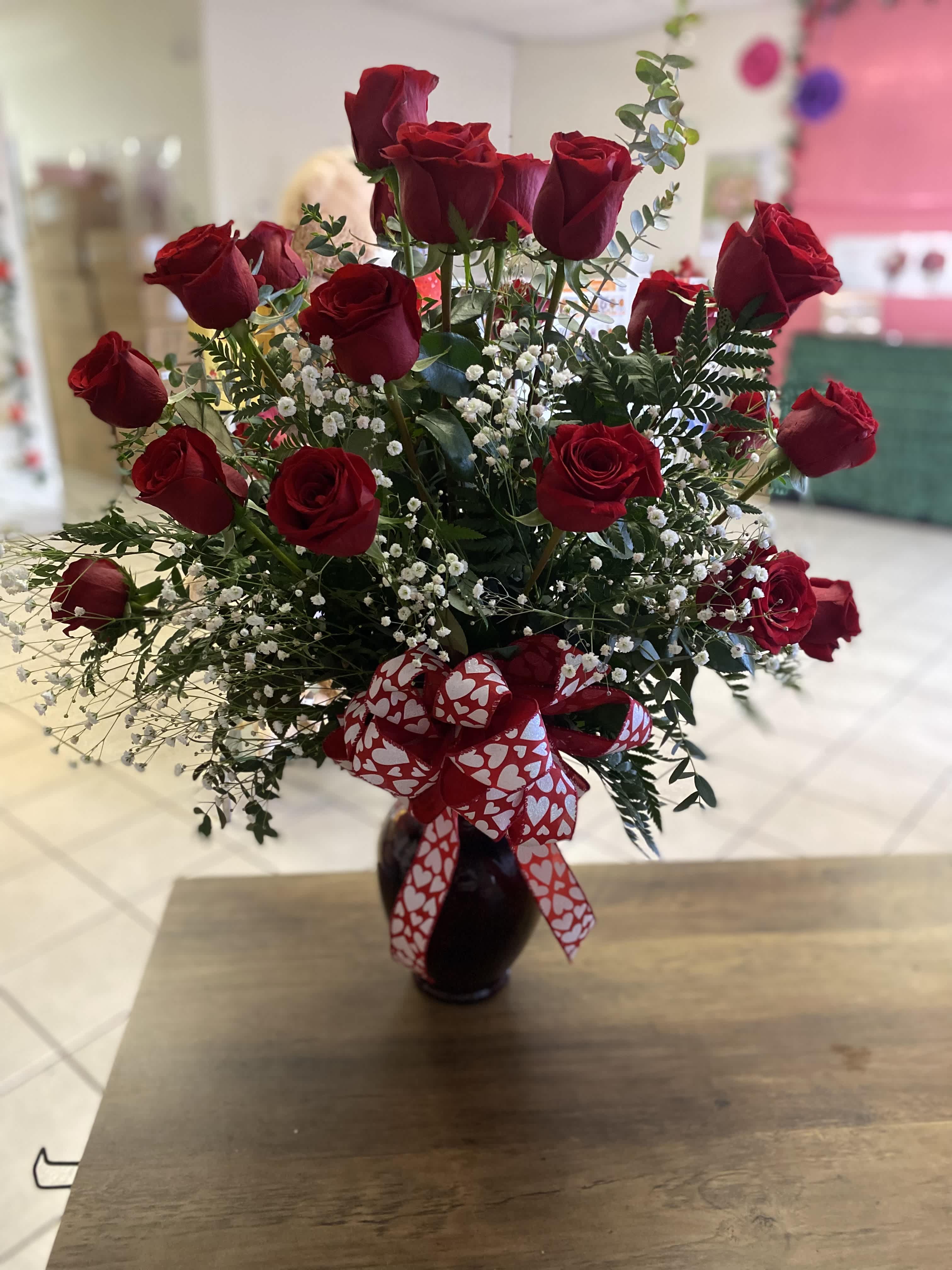 24 Red Roses in an arrangement  - 24 red rose arranged a beautiful large red vase. 