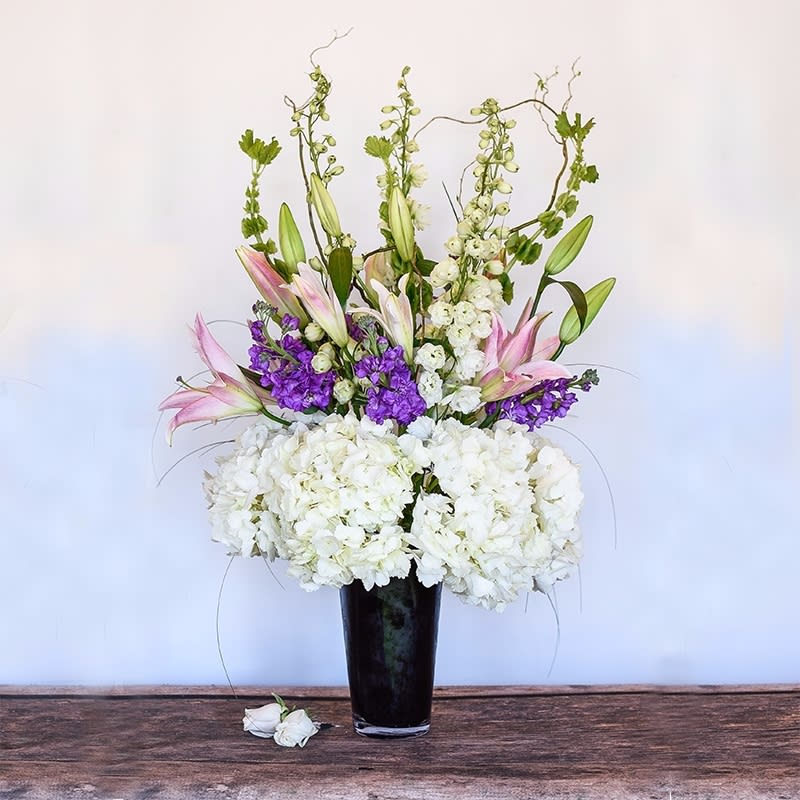 Elegant - This lush, impressive arrangement is designed with soft, calming pastels.   