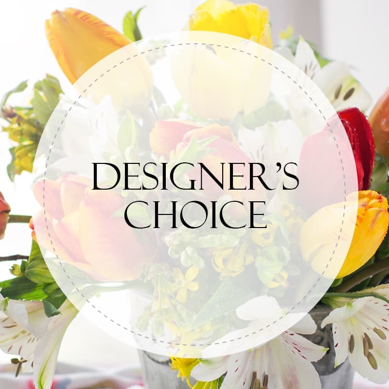 Designers Choice Arrangement Brights - Allow us to arrange a bright mix of our freshest blooms for you.  Presented in a clear glass vase, this assortment will deliver a bright smile!
