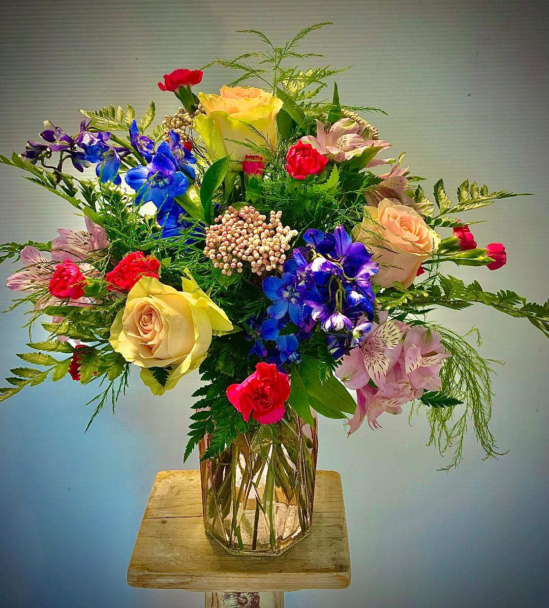New Love? Standard - Pink Roses with Blue Delphinium and Pink Rice Flower are the main feature of this perfect arrangement for the new love in your life, or the love of your life!