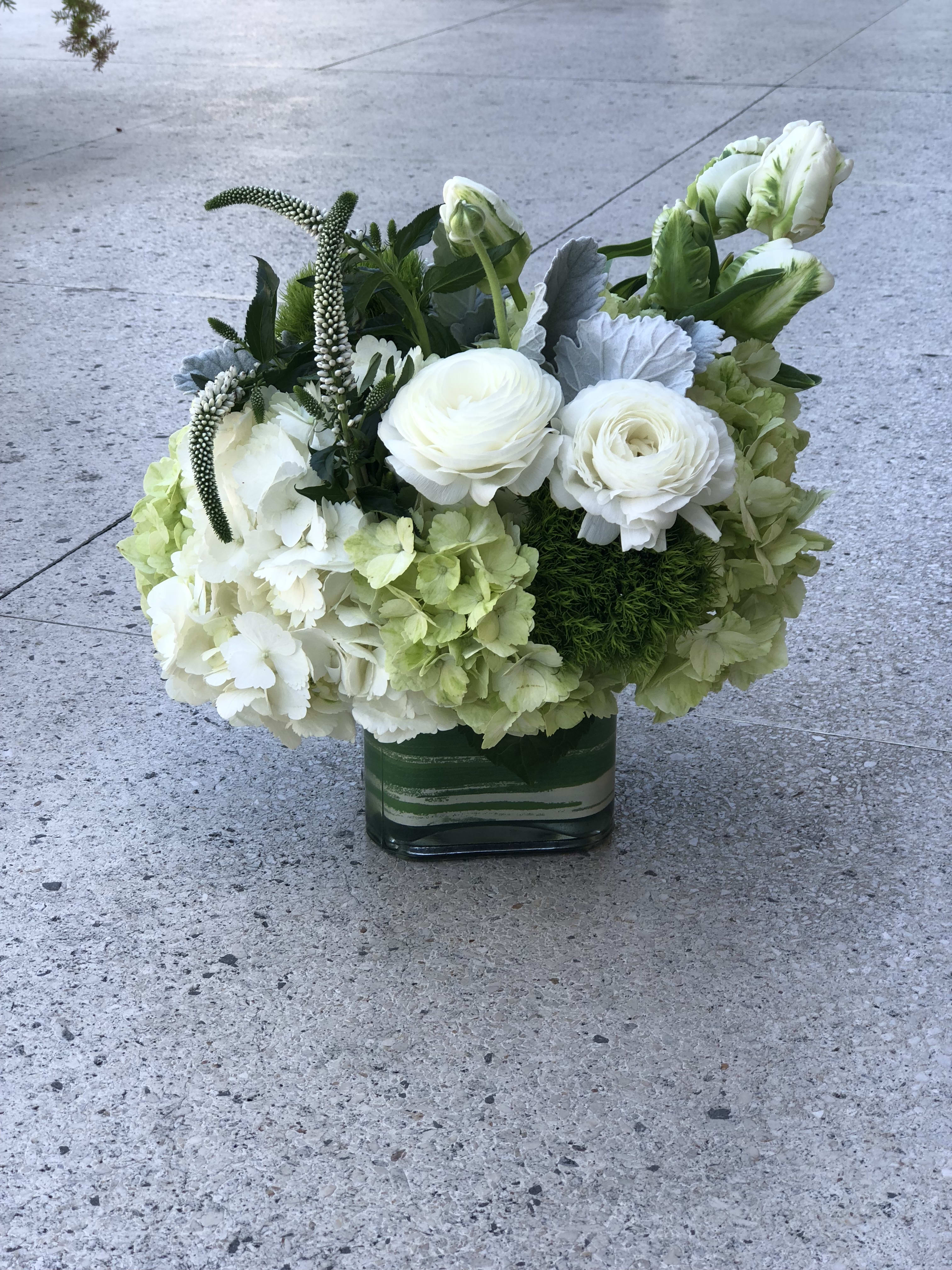 The Rio Bravo - Inspired by Bakersfield's neighborhood with some gorgeous views, this classy arrangement is filled with hydrangeas, tulips, ranunculus, dianthus, veronica and dusty miller and is perfect for any occasion.