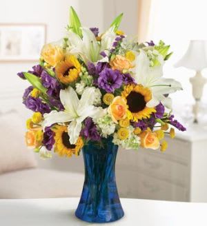 French Garden Bouquet - They're unique, exciting and colorful. Send a gift that captures their personality--a stunning tribute to the beauty of French gardens. Fresh roses, lisianthus, lilies, sunflowers, stock and more in an exquisite new design from our expert florists  Arrangement measures approximately 24&quot;H x 20&quot;D It's a stylish and romantic way to express your feelings. Components may vary.   