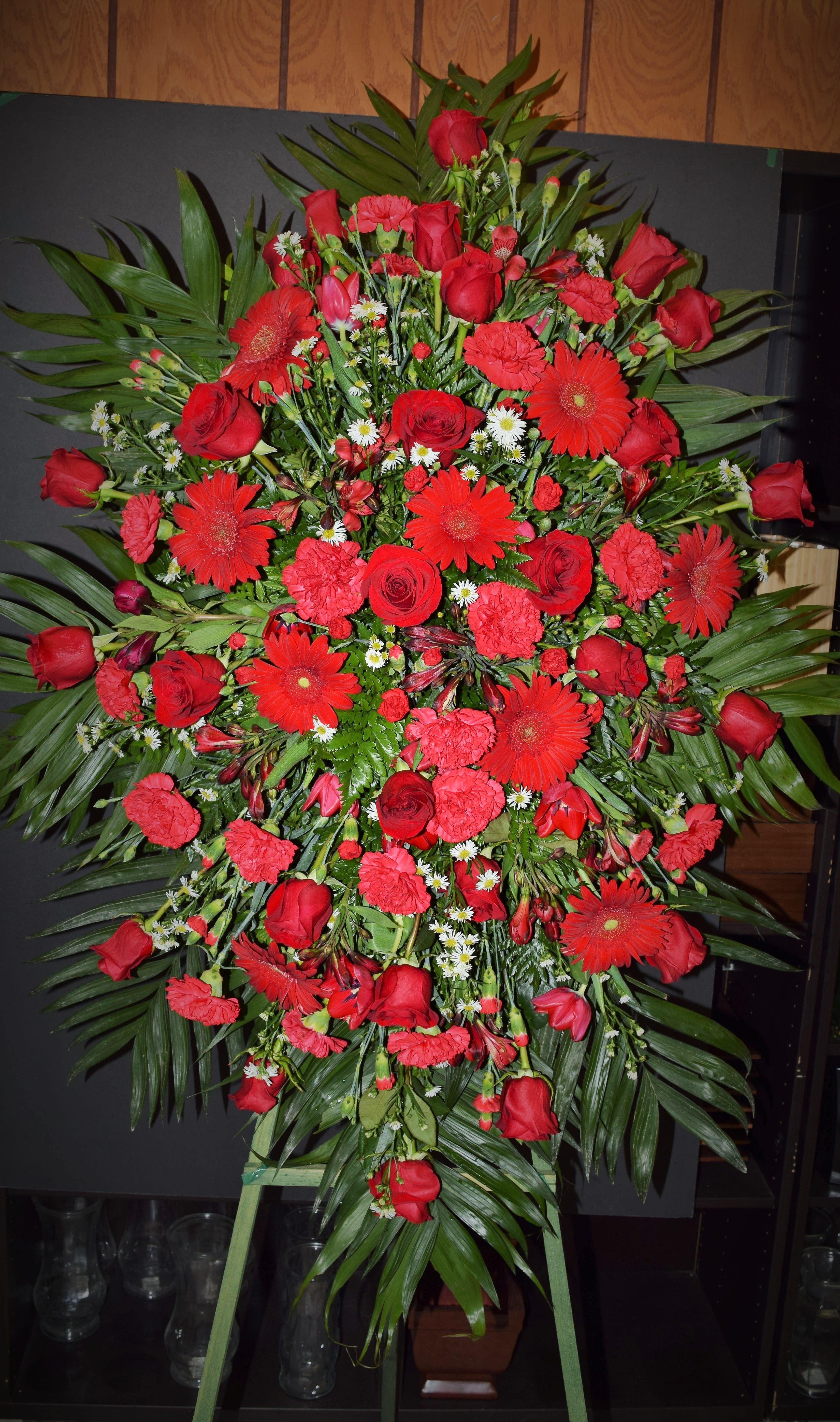 1029.SSG               Standing Spray - Roses, Carnations, Gerbers AS SIMILAR AS POSSIBLE Substitution based on season, flowers availability or any unforeseen or uncontrollable circumstances 