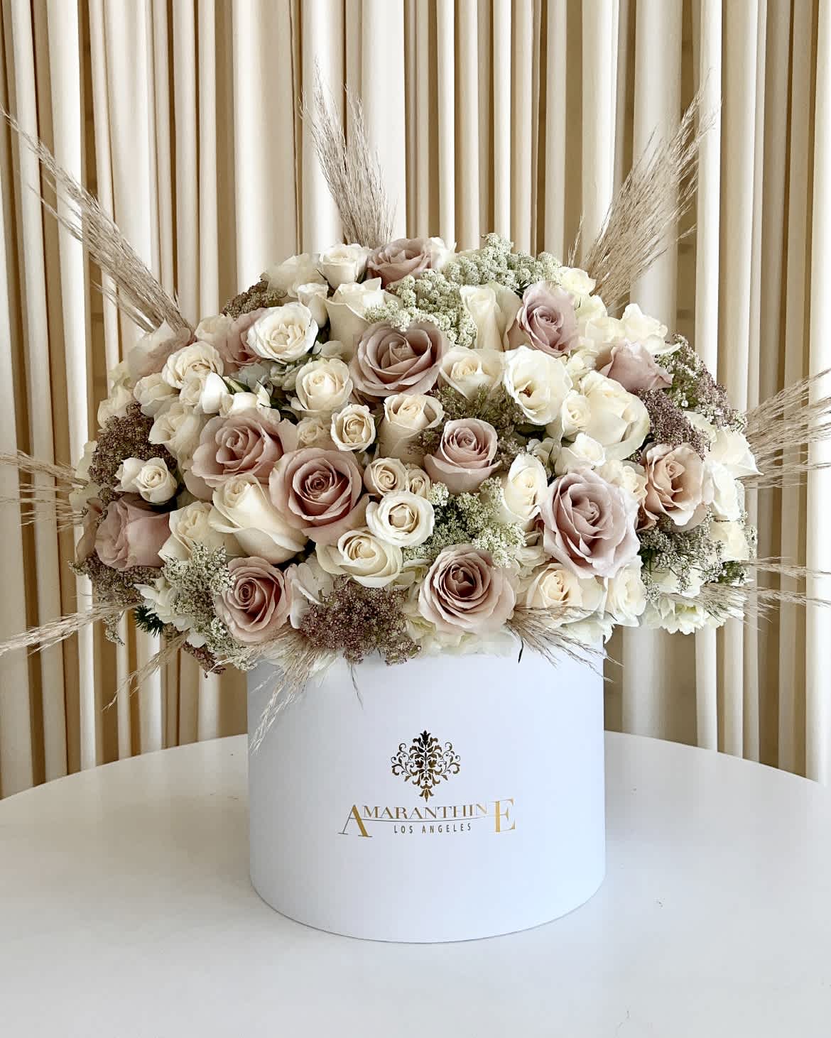 Earthly Elegance - Embrace the beauty of simplicity with our &quot;Earthly Elegance&quot; Flower Box. Nestled within a pristine white box are exquisite blooms in earthy, neutral tones, curated to perfection. This minimalist yet sophisticated arrangement captures the essence of nature's grace, making it a stunning gift or an enchanting centerpiece for any space. Elevate your surroundings with the timeless charm of &quot;Earthly Elegance&quot; and let the natural allure of these flowers brighten your day. 