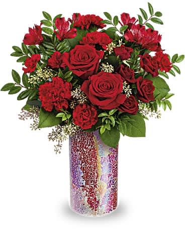 Teleflora's Send A Shimmer Bouquet Teleflora's Send A Shimmer Bouquet - Send a shimmer she'll never forget with this wonderfully romantic red rose bouquet arranged in a sparkling mosaic glass vase she'll always treasure. Red roses, red spray roses, red carnations, miniature red carnations and red alstroemeria are accented with seeded eucalyptus, huckleberry and lemon leaf. Delivered in Teleflora's Love Sparkles vase. Orientation: All-Around