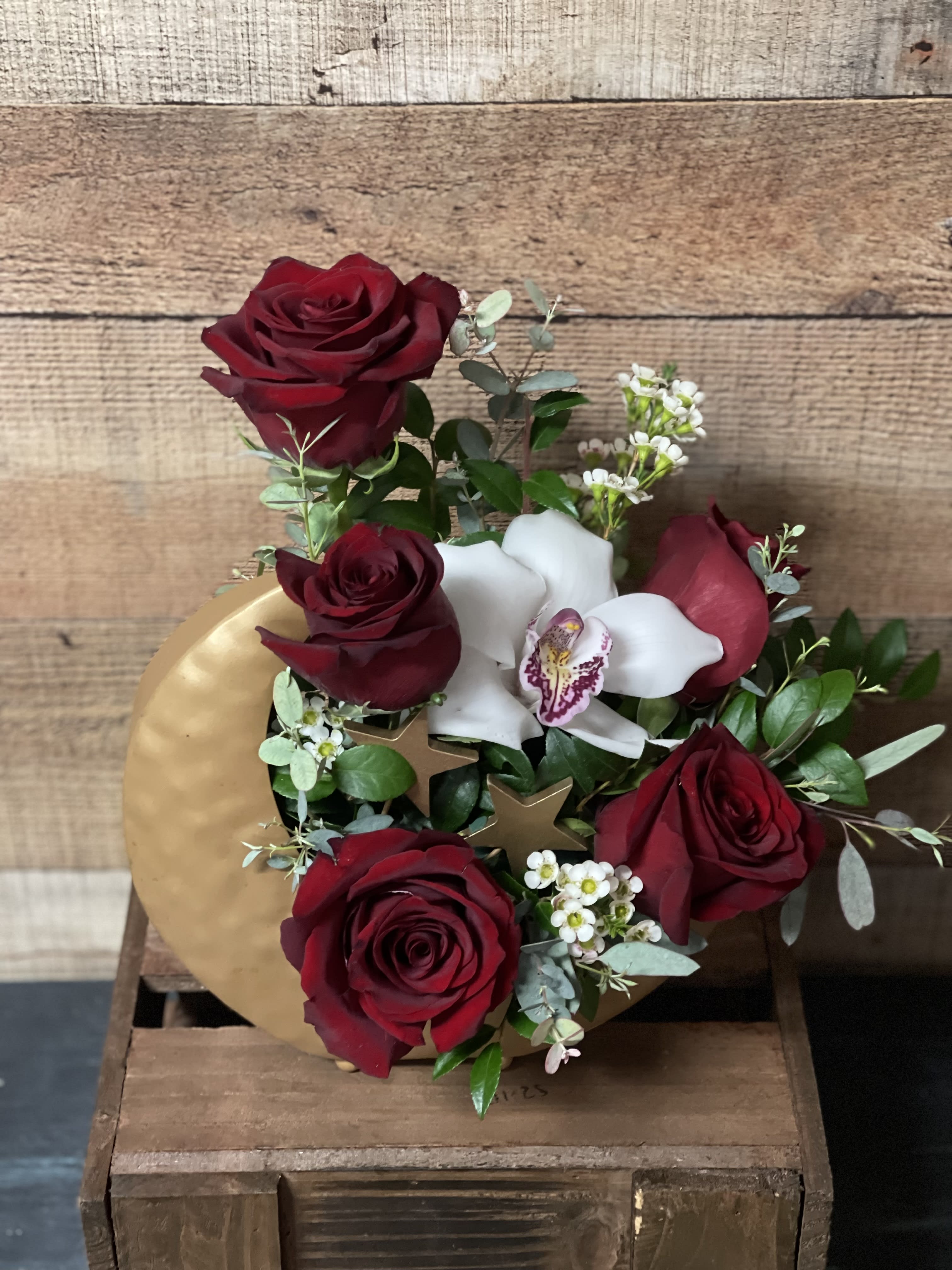 To The Moon And Back - An arrangement of red roses cymbidum orchid and in a moon and stars metal keepsake