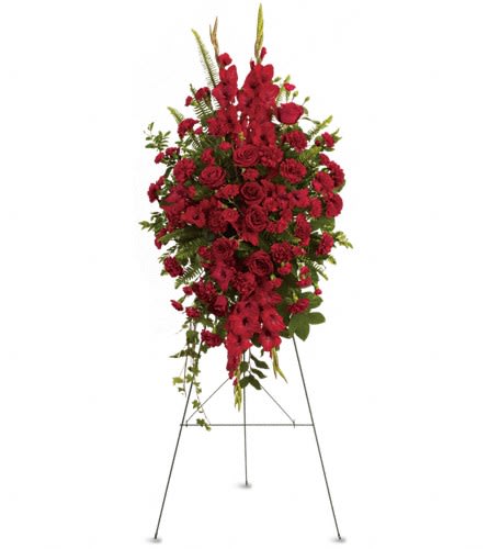 Deep in Our Hearts Spray - This rich radiant spray of red roses gladioli and other popular red flowers during a time of loss conveys a message of reassurance and hope in a difficult time. The radiant arrangement includes red roses red gladioli red carnations and red miniature carnations accented with assorted greenery.Approximately 26&quot; W x 52&quot; H Orientation: One-Sided As Shown : T270-1A