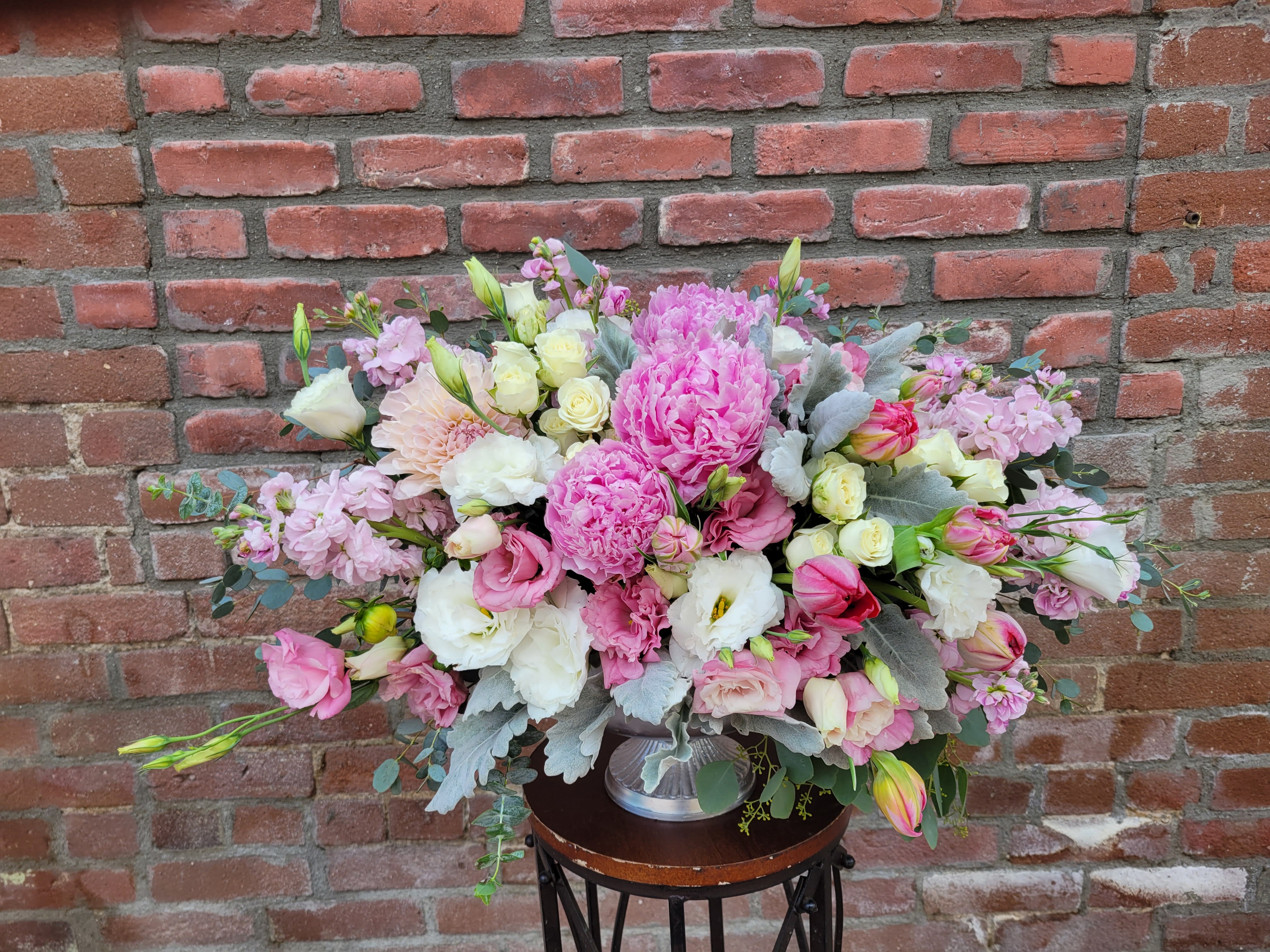 garden dream - composed of dahlia, peonies, dusty miller, lisianthus, tulips, stock white spray roses and mixed greens 