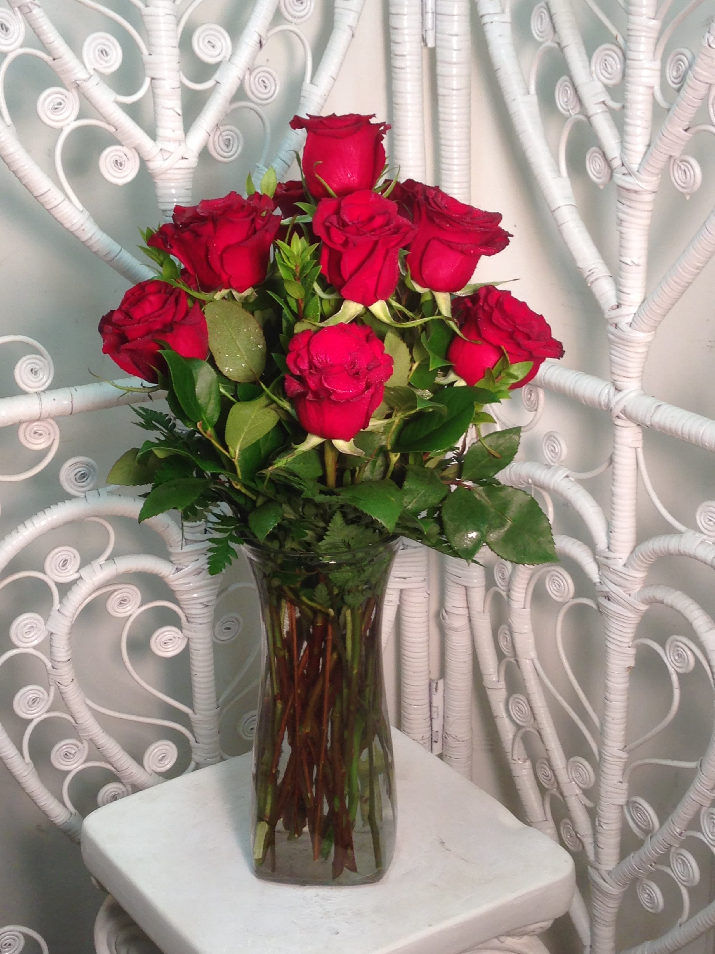 Deeply In Love Red Roses Deeply In Love Red Roses - Arranged to impress! One dozen premium long stemmed red roses elegantly vased with lush, fresh greenery.