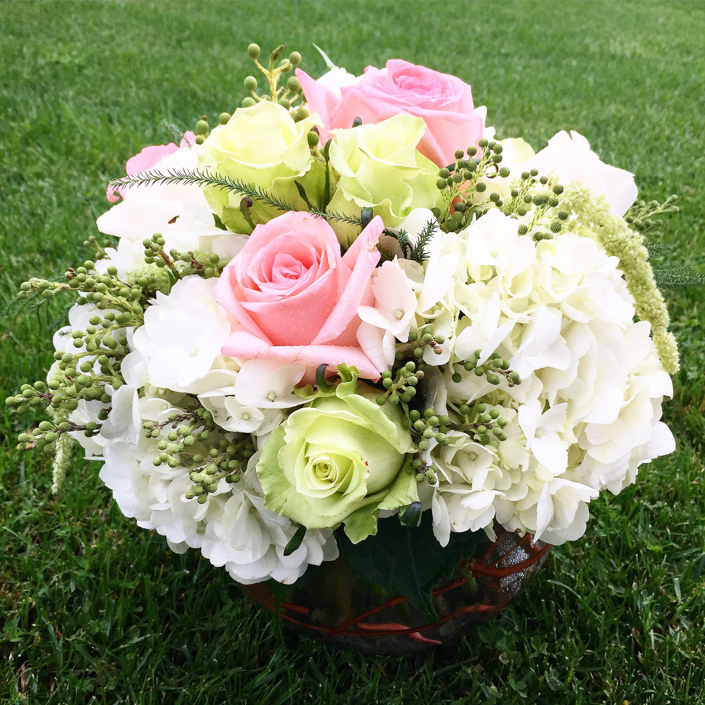 Pastel Surprise  - Surprise a loved one today by sending this fresh mix of pastel and jade roses, hydrangeas and brazilian elegantly arranged in a keepsake glass bubble vase.  Whether to say hello, thank you, missing you, congratulations or just because...this roundy moundy bouquet will become a memory to be cherished forever!  Approximately 10&quot; D