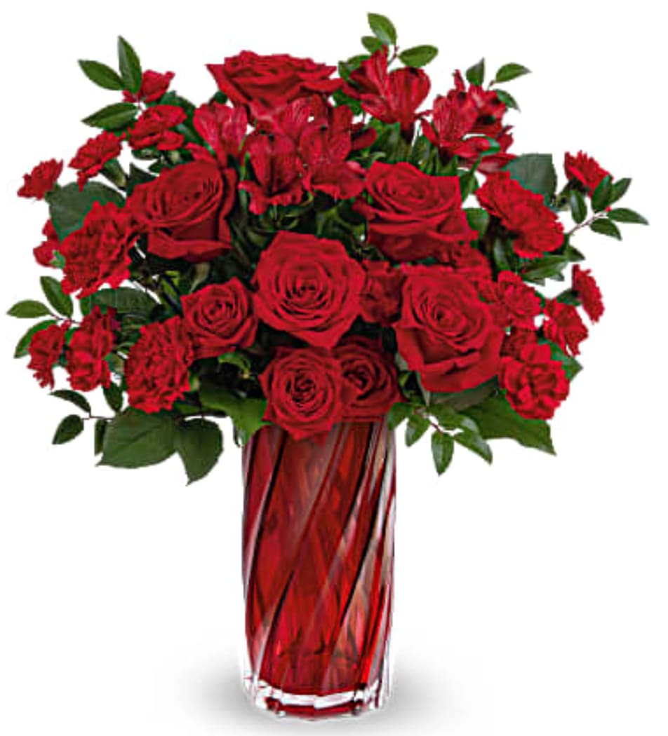 Meant For You - Say it like you mean it with this dramatic Valentine's Day bouquet of ravishing red roses in a shimmering art glass vase with swirling design. 