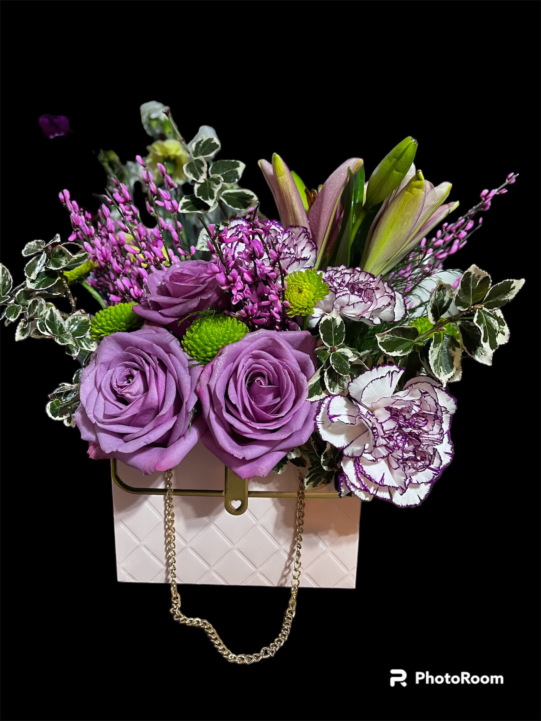 My Little Pink Purse My Little Pink Purse - Every girl needs a little pink purse! We just fill ours with beautiful blooming flowers of pinks and lavenders. This adorable purse even has chain handles to bring your arrangement into the next level of class.
