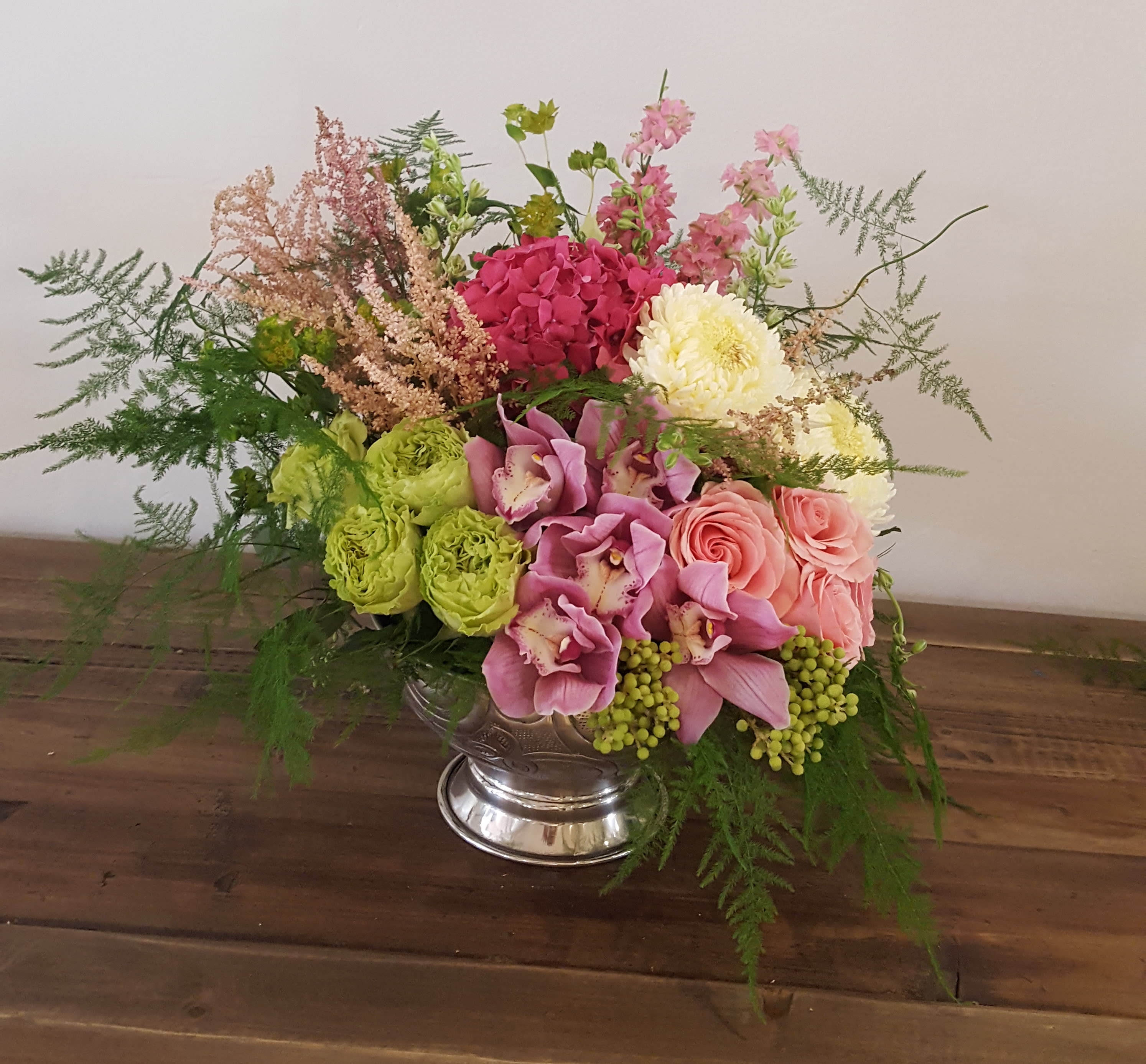 Garden Parade Garden Parade - Composed of Roses, Orchids, Astilbe, Chrysanthemums.