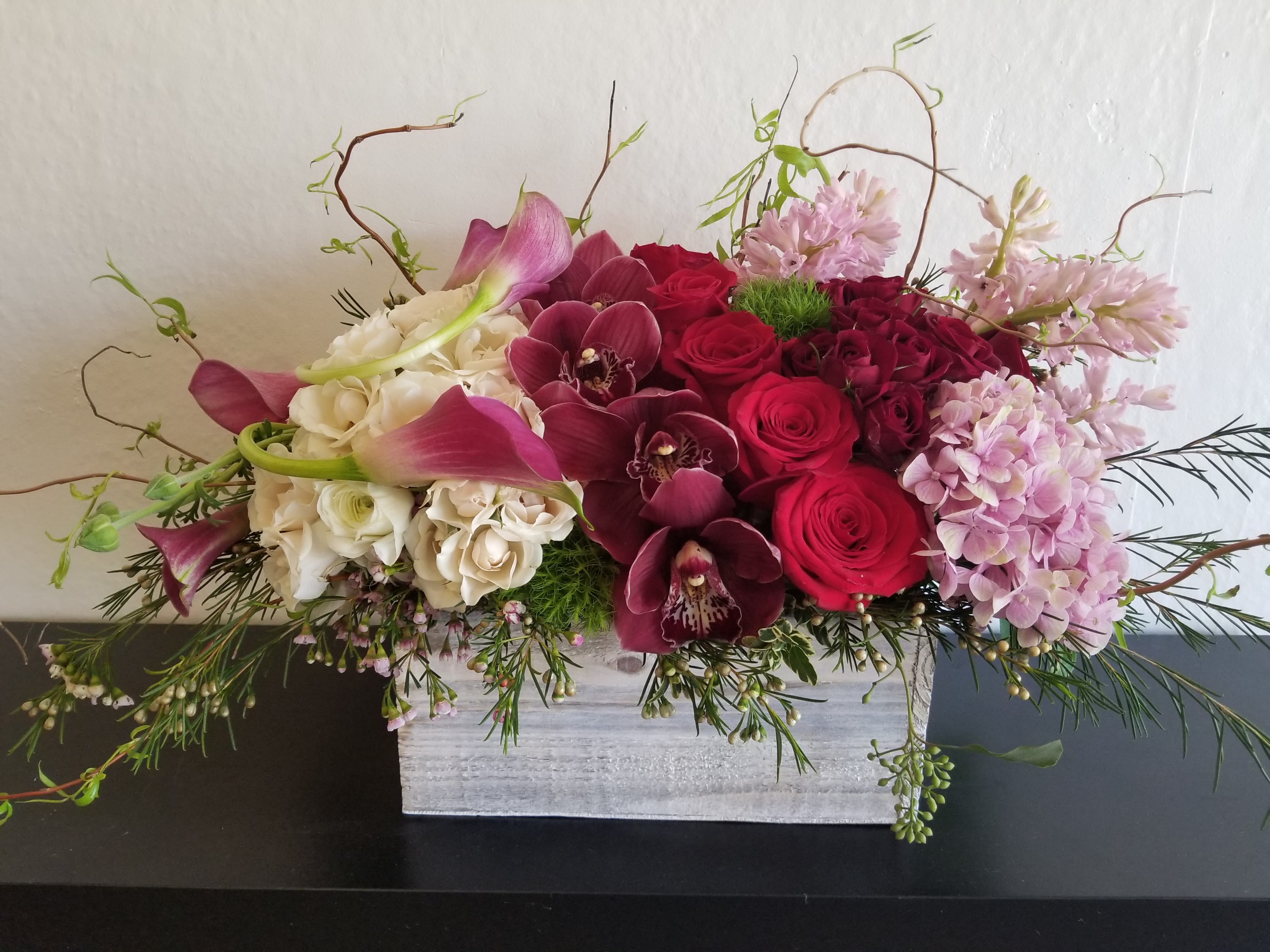 Affection Affection - Composed of Orchids, Hydrangeas, Calla Lily, Spray Roses, Roses, Curly Willow, Variety of Green.