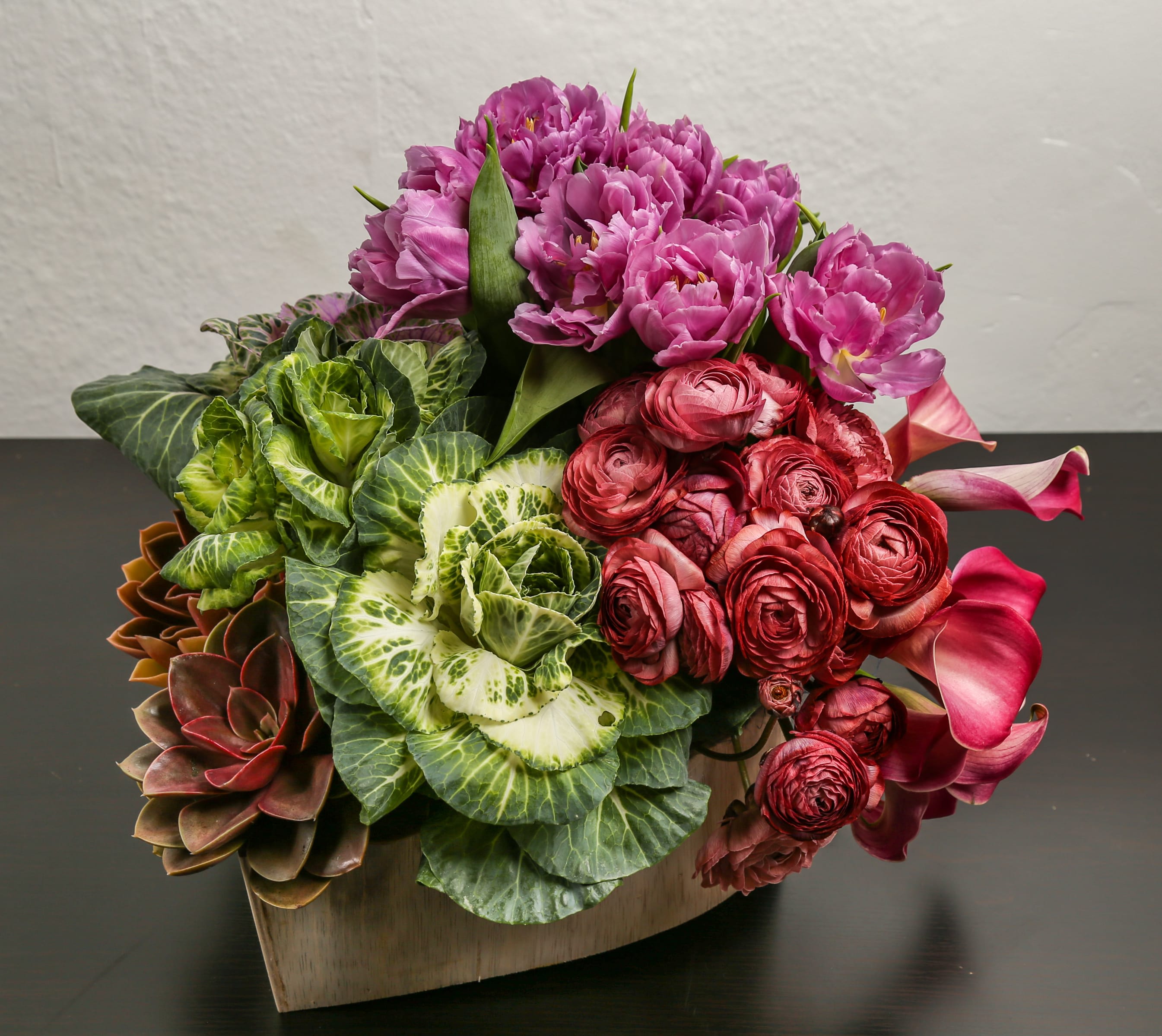 Garden Date - Composed of kale, tulips, ranunculus, Calla lily.
