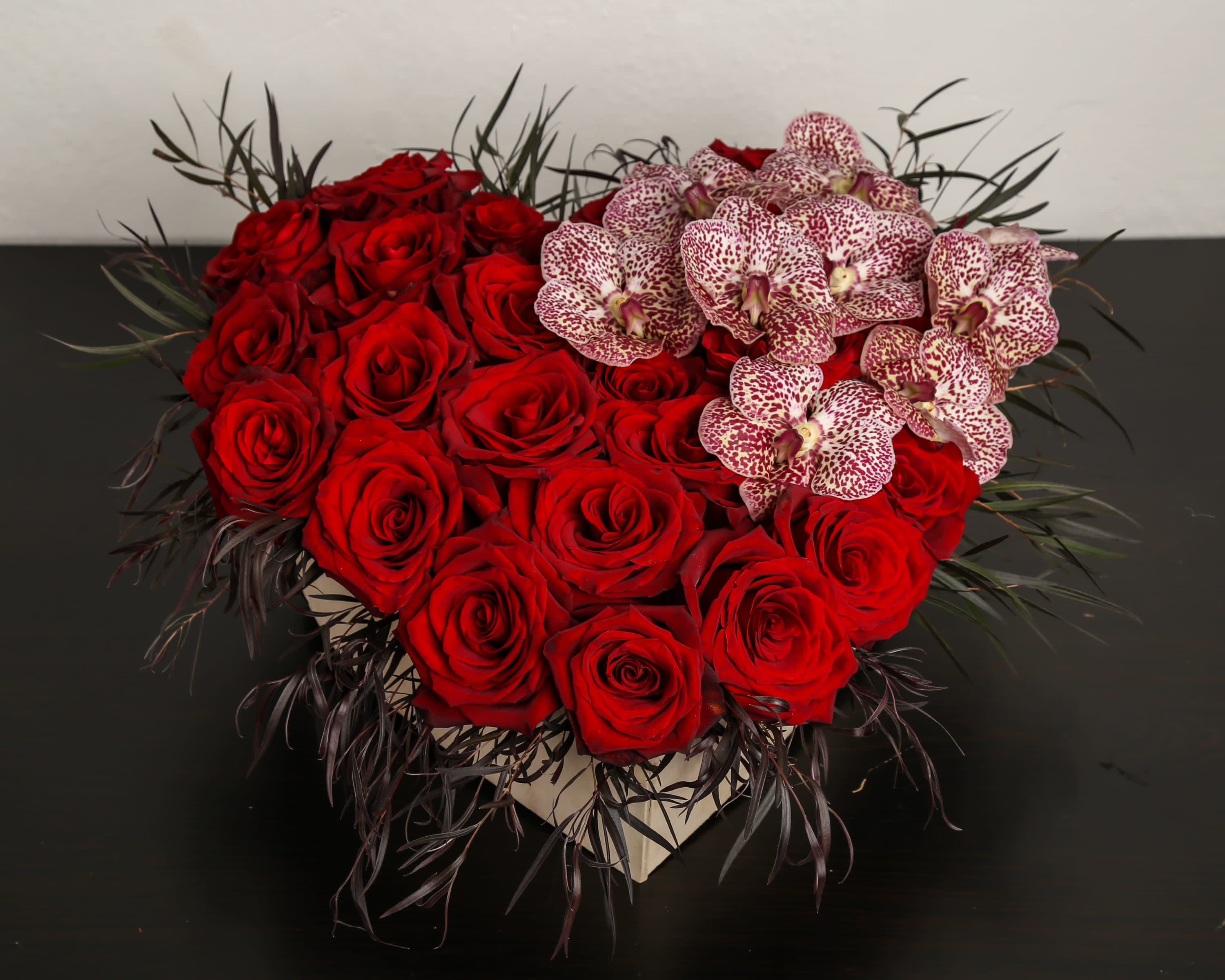 For The Unique Heart For The Unique Heart - Composed of roses, orchids.