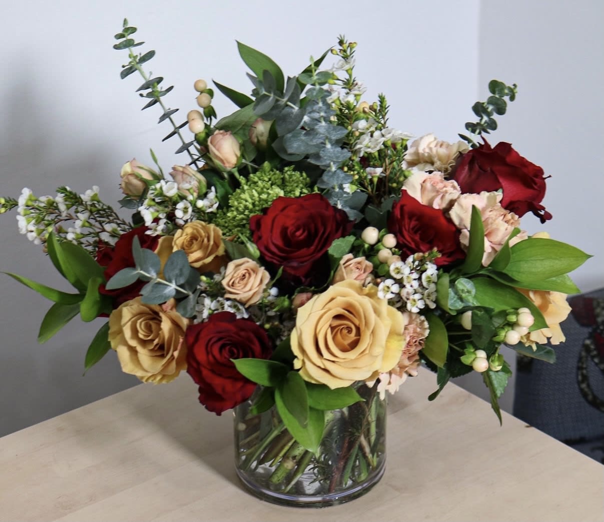 Leave Your Mark - Elevate your love with the perfect vase arrangement that blends elegance and romance. Delight in the contrast of deep reds and toffee roses, adding a touch of passion to every glance. Whether celebrating love's grand gestures or cherishing life's simple joys, this enchanting arrangement will captivate hearts.  