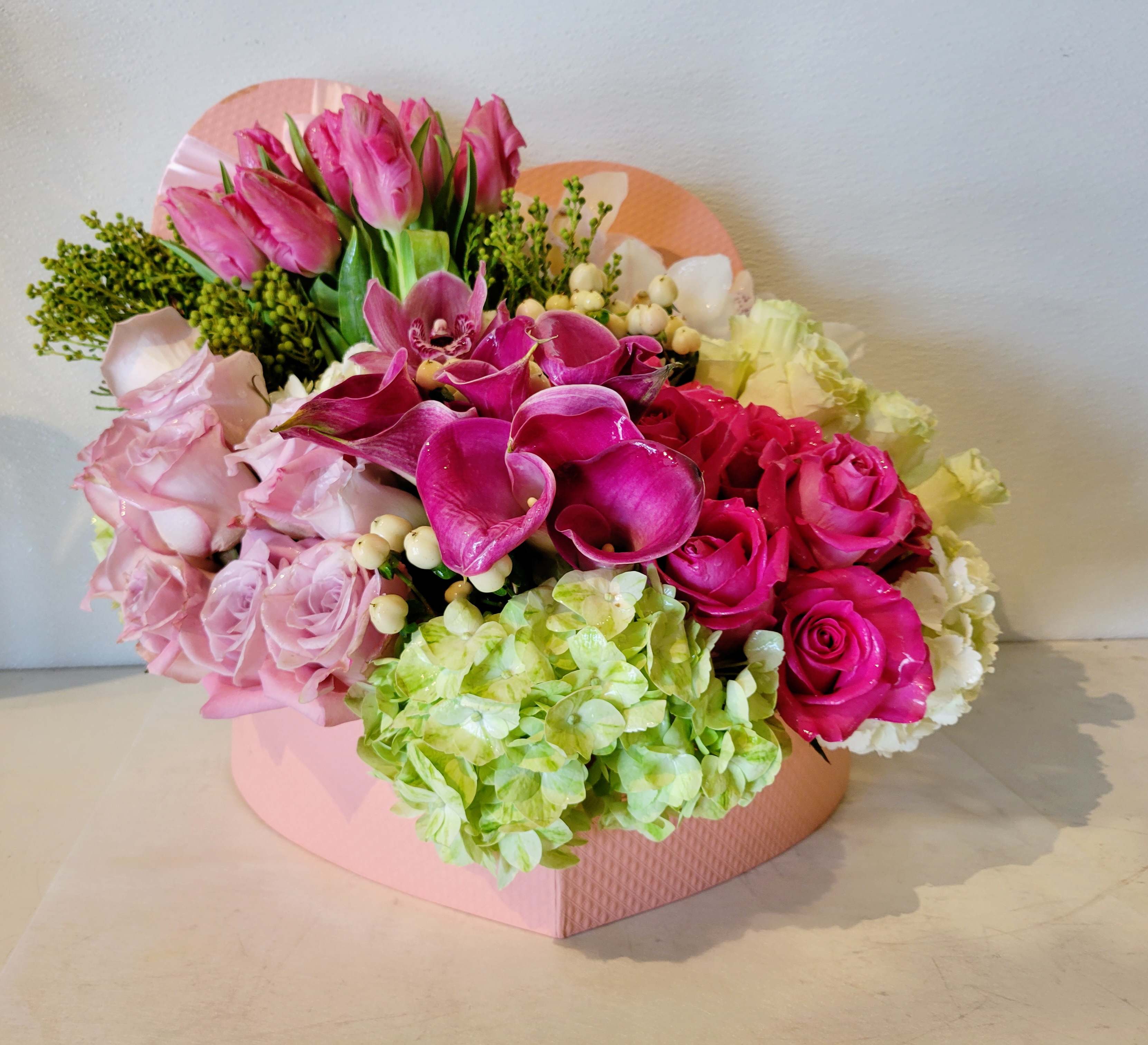 Blossoming Heart - Lovely heart box display with assorted soft and gentle blooms.