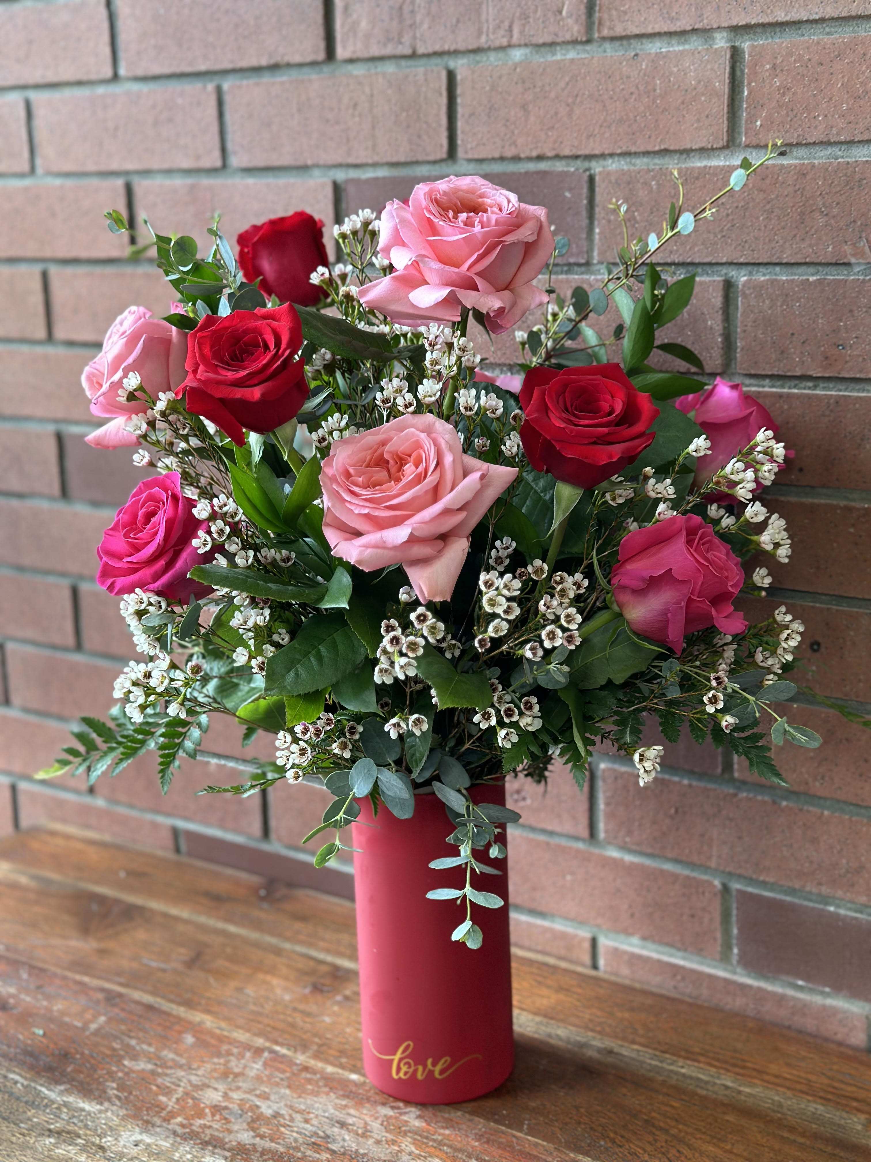 My Love - Long Stem Pink, Red, and Hot Pink Roses, with Lush Greenery and Filler. In a tall cylinder red vase, with the word &quot;Love&quot; written in gold cursive. 