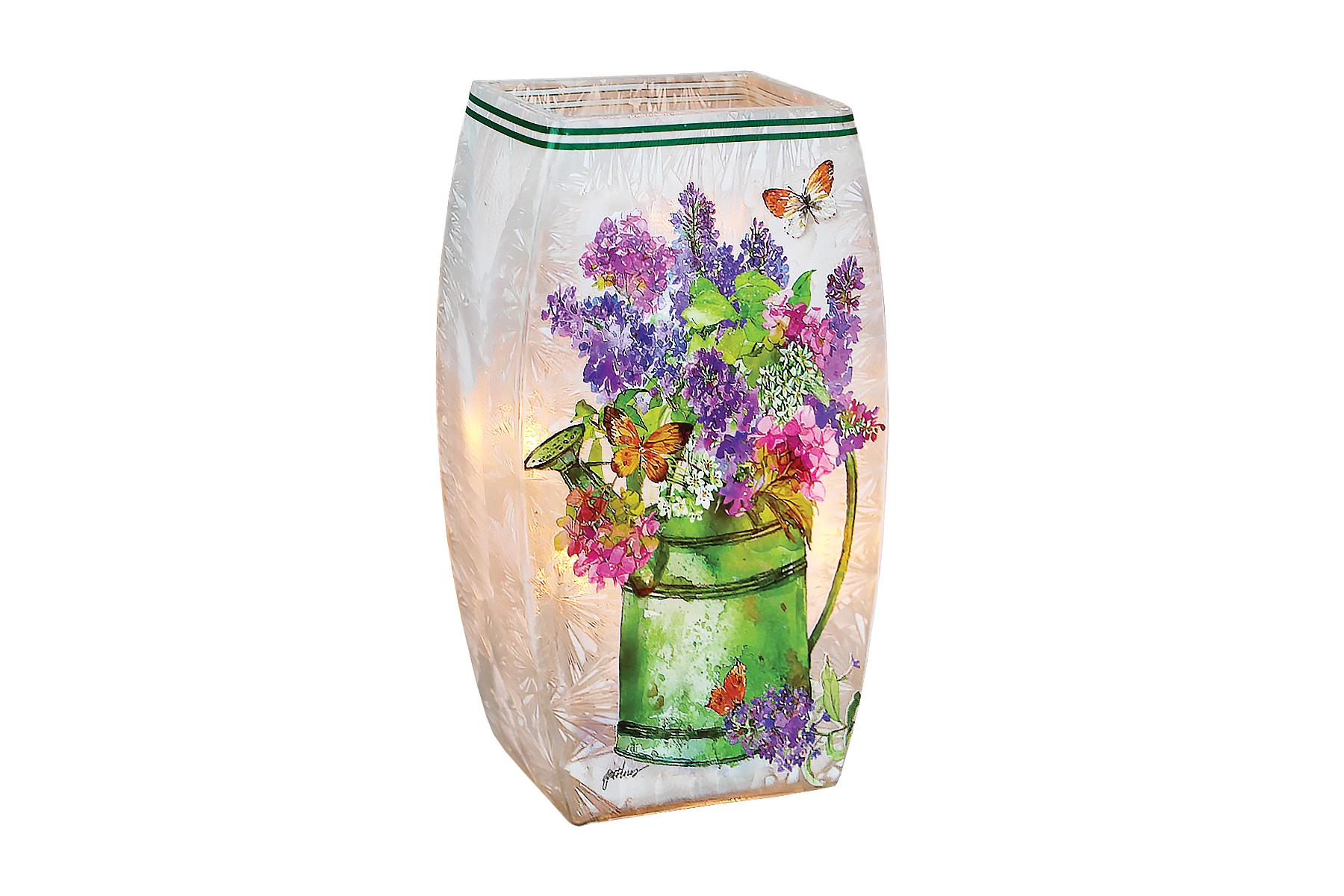 Lilacs and Butterflies with Watercan Crackle Glass Memory Lamp Medium - his crackle glass memory lamp is 4.53 W x 2.36&quot; Diameter and  7.87&quot; in Height. It has Lilacs, butteflies and water can arrangement. Electric led lights inside. Comes with special card that reads &quot; This lamp has been specially selected by... to honor the memory of.... Each time you light this lamp, may you recall the many wonderful occasions that you have shared together and their light continues to shine and touch your life. With Deepest Sympathy. Deluxe and Premium includes a wreath of fresh flowers.   