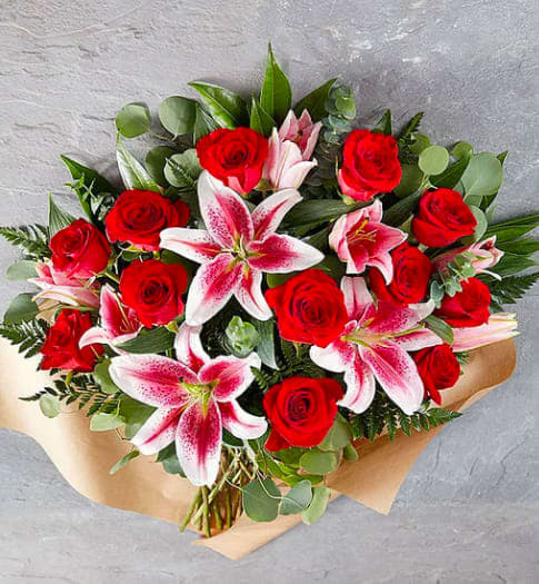 Wild Beauty Irresistible Bouquet - When there’s no resisting expressing how you feel: our Irresistible bouquet. Softly gathered blooms of pink and red for undeniable allure, with kisses of white and green to add to the romance. Don’t be shy… this one says it all.