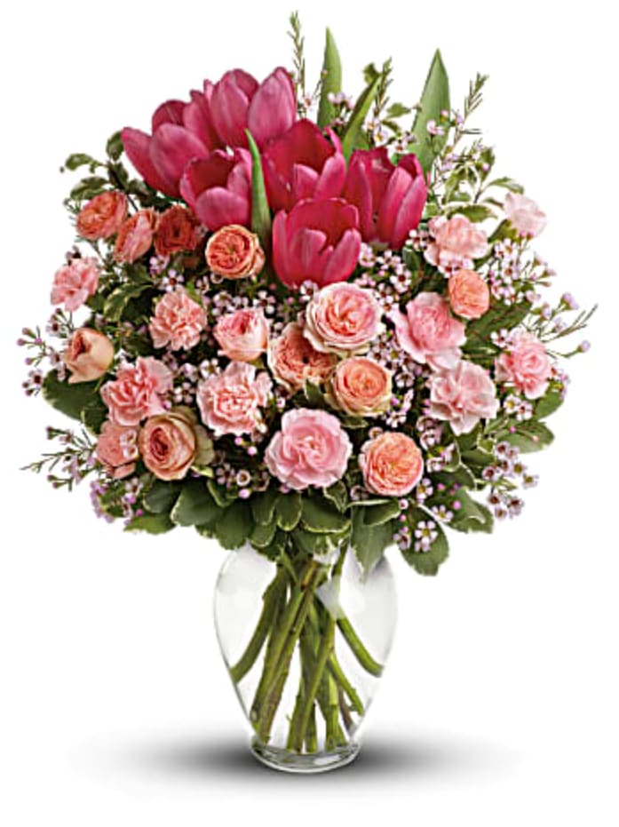 Full of Love - It's beauty-full! Bursting with tantalizing tulips and radiant roses, this delightful pink arrangement brings spring joy to that special someone.