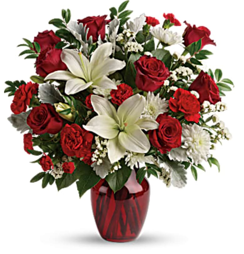 Visions Of Love - Give your special someone visions of love with this luxurious gift of bright white lilies and romantic red roses, presented in a radiant red vase.